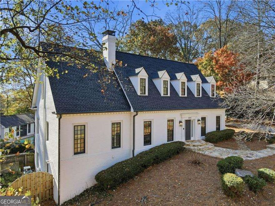 Welcome to Valemont Drive. An elegant French Provincial retreat in one of Sandy Springs' most coveted and connected locations.  Perfectly positioned just minutes from GA-400, Sandy Springs City Center, Historic Roswell, East Cobb, and Avalon, this 4-sided brick estate offers the rare combination of timeless architecture, modern updates, and an unmatched lifestyle. Step inside to find refined living spaces and a beautifully renovated chef's kitchen featuring professional-grade KitchenAid appliances, custom cabinetry, and an effortless flow ideal for both intimate gatherings and large-scale entertaining. Thoughtful design continues with primary suites on both the main level and upper level, offering exceptional flexibility for multi-generational living. The lower-level private suite is a standout feature..complete with its own entrance, full kitchen, dedicated laundry, spacious bedroom, and bath. Perfect for extended-stay guests, an au pair, or turnkey rental income, this suite elevates both convenience and value. The resort-style backyard is a true sanctuary. Enjoy a large heated pool, lush landscaping, and ample space for lounging, dining, and outdoor entertaining..all enveloped in privacy. Additional upgrades include fresh interior paint and carpet, plus a full roof replacement in 2022, offering peace of mind and modern comfort. Residents benefit from no HOA, while still enjoying the opportunity to join the distinguished Huntcliff community, known for its exceptional amenities...swimming, tennis, a private riverfront dock, and equestrian facilities with on-site horse stables. This coveted membership option adds a rare lifestyle dimension few neighborhoods can match.