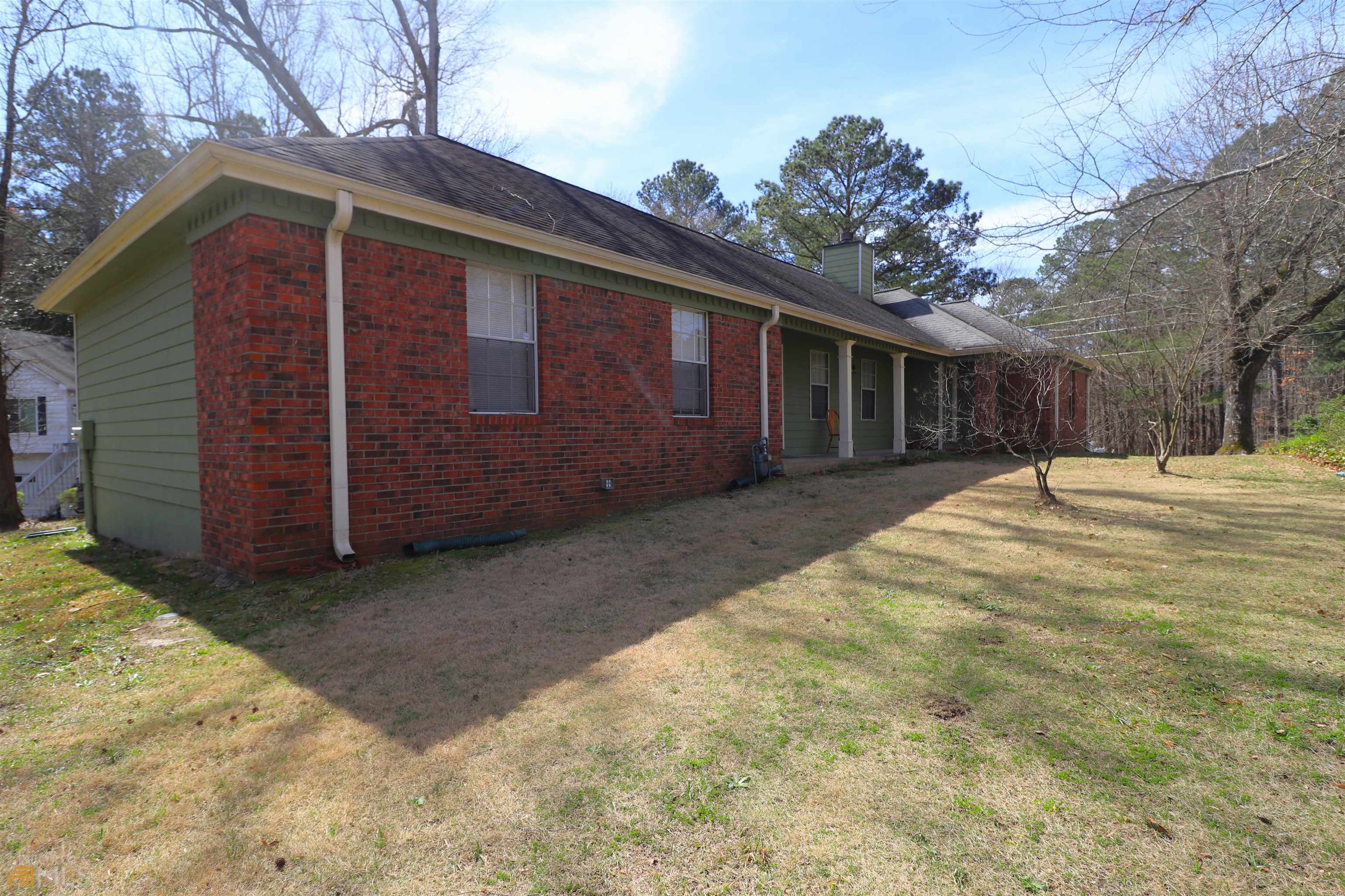 Great floor plan with great flow. Large family room with dining area and brick fireplace. Very nice large master bedroom with access to screened porch overlooking full length party deck. Secondary bedrooms are very nice size and one with hardwood floors. Kitchen with separate breakfast room and breakfast bar. Newer heat pump is only 2 years old. Covered front porch and oversize 2 car garage with rear entry. Home is in great condition but has been leased for 5 years, PROPERTY SOLD AS-IS!!! Home is priced accordingly!!!!