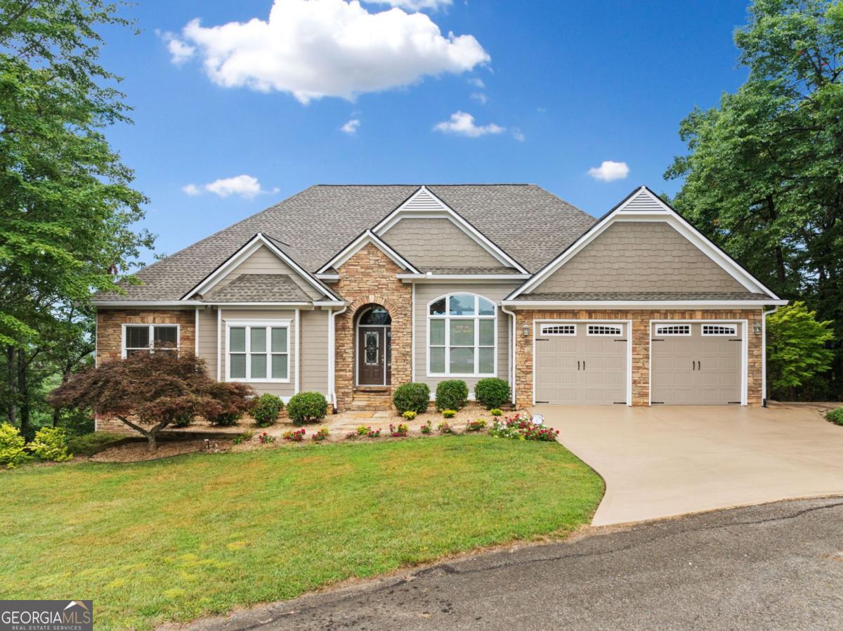 Elevate your lifestyle in this exquisite retreat located in the prestigious gated enclave of Turkey Knob Estates. Sweeping, layered mountain views & golden-hour sunsets from throughout this custom-crafted residence that offers refined luxury in a serene, nature-rich setting just minutes from the Cohutta Wilderness, Bear Creek Trail, Lake Conasauga, Fort Mountain, & Pinhoti Trail. The Hardie-board & stacked stone clad exterior welcome you in to the foyer of this traditional home with an elegant dining room & a generous great room lined with oversized windows & glass sliders that frame the majestic mountain backdrop. The kitchen is a dream for culinary enthusiasts, featuring a 2-tiered island w/bar seating, abundant custom cabinetry & counter space, plus a large walk-in pantry within the oversized laundry room. A charming bay-window breakfast nook offers a front-row seat to the spectacular view. The master suite is a private sanctuary, w/tray ceilings, sliding doors to the rear deck & an attached sitting room or office with picture windows. The spa-like ensuite features dual vanities w/custom built-ins, soaking tub, tiled shower & massive walk-in closet. The main level also includes a spacious guest room, full bathroom & a separate home office or flex room ideal for remote work or hobbies. The terrace level offers additional living space w/a 2nd living room, access to another covered deck, plus a full bath & 2 more bedrooms, one with attached sitting room or nursery & walk-in closet. A vast, unfinished subbasement plus basement level offers endless potential for future expansion, wine cellar, gym, or media room. This exceptional property offers the perfect balance of privacy, elegance & outdoor adventure, set within a coveted gated community w/all paved roads, large lots & no STRs permitted, preserving the peace & exclusivity of the neighborhood. A short, scenic drive to downtown Ellijay, yet a world away in lifestyle, this is elevated mountain living at its finest.