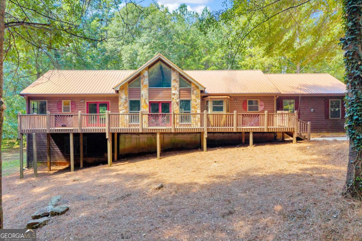 Welcome to your own private getaway on 12 acres in the up and coming city of Mansfield! Well-maintained 2 bedroom / 3 bath ranch on a full unfinished basement. There is a finished bathroom in the basement, but remainder is unfinished space that can be used as additional bedrooms, play area, workshop, office, or gym! The large lot allows for endless opportunities - hard to find this much land at this price in today's times! Plenty of natural light with vaulted ceilings in the main living area and floor-to-ceiling windows. Spacious master bedroom with walk-in closet and direct access to your back deck. Master bathroom offers a soaking tub with stand up shower. Enjoy the large, cozy front porch and back deck while you overlook your private and expansive 12 acre lot. Double car garage and long driveway provides ample parking. All systems are in working order. Just a short drive to downtown Mansfield and walking trails or under 20 minutes to downtown Covington. Schedule a tour today to see what all this home has to offer!