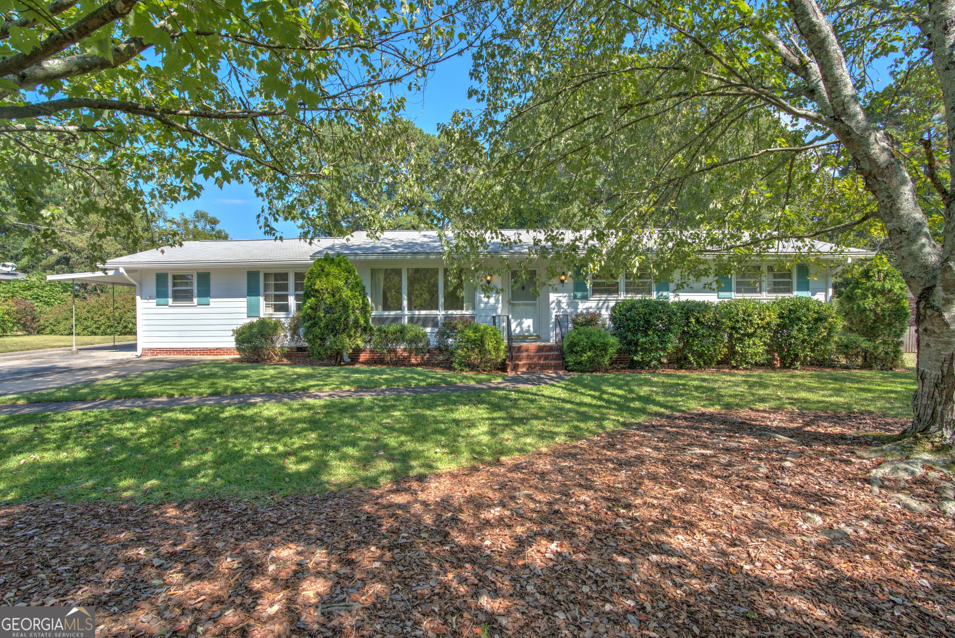 One of the larger lots in Cherokee Acres, this home is nearly 2500+- sq feet on one level, has beautiful painted redwood siding, and an extremely private niced sized fenced back yard. 4 living spaces total, including cozy paneled den with fireplace, formal living room, covered porch, and large addition with fireplace could also be made into a 4th large primary bedroom. Two dining areas, including cool breakfast booth and formal dining room off of the living room. Back deck large enough for an outdoor dining for a big family or groups of friends. Sewing room off back bedroom could also be a nursery, an office, or could be remodeled into a large primary bathroom. Deck and covered porch overlooks an expansive level back yard that leads to an oversized workshop with power for hobbies and tinkering... or a potting shed, or extra storage. Parking carport for cars/ boats, and also a large parking pad for an RV, or just additional vehicle parking. Come see this one of a kind home in Cherokee Acres!