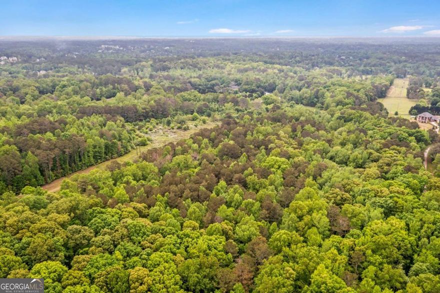 Discover +/- 27 acres in the prestigious city of Milton/Alpharetta. This is one of the last remaining tracts of its size in Milton, featuring wooded acres adorned with spectacular hardwood trees, nestled among multi-million dollar estate homes. This property offers the perfect opportunity to build your private estate or develop luxury homes. Conveniently located close to Alpharetta Square, you'll find entertainment, shopping, upscale boutiques, fine dining, and Whole Foods. The property is just 1 mile from The Manor Golf and Country Club and provides easy access to GA 400, yet all you hear are the serene sounds of birds chirping. Please note: An appointment is necessary to walk the property. Kindly schedule an appointment with the listing agent before visiting.