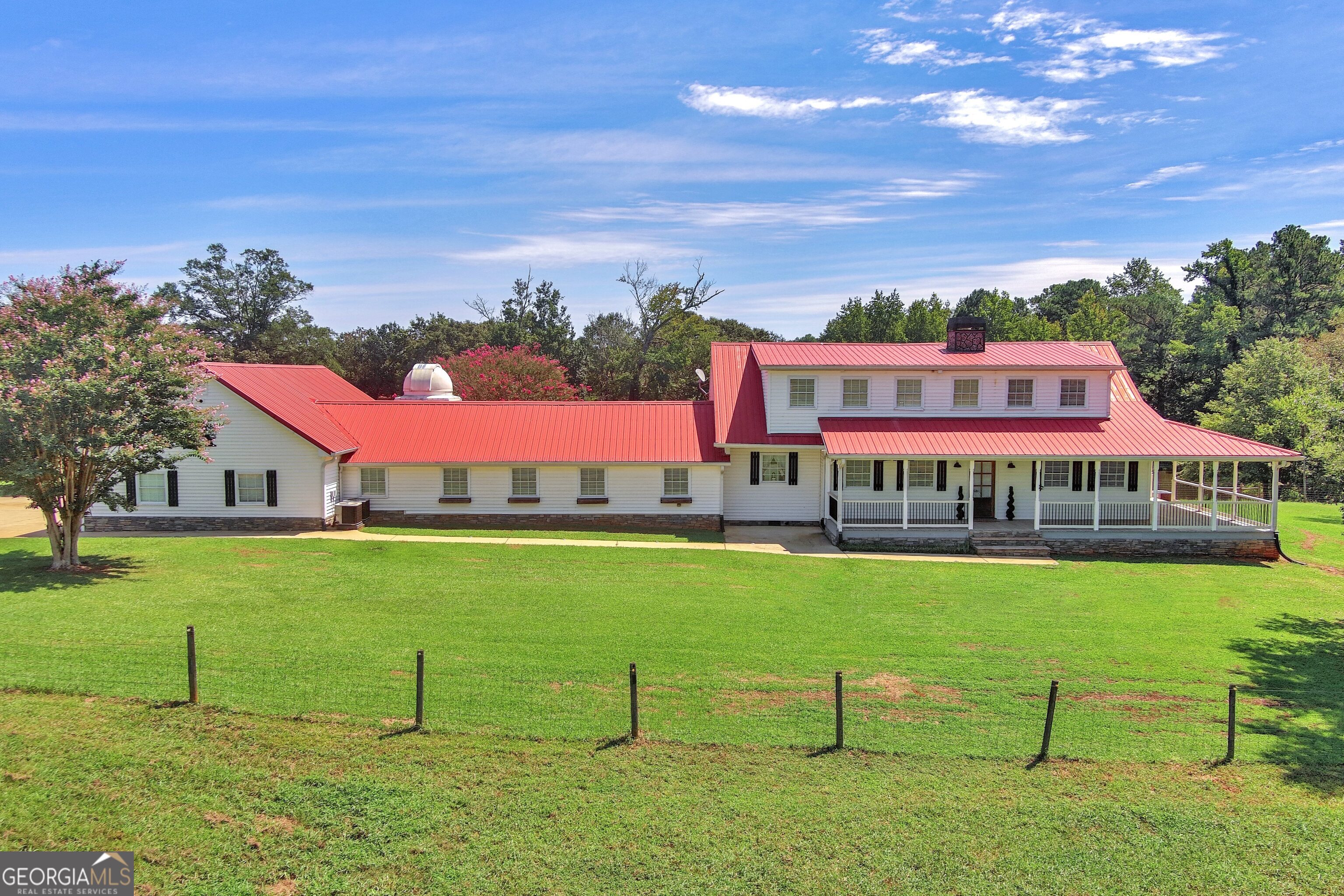 HOLY COW - INSTANT EQUITY ALERT! Welcome to your dream modern farmhouse, perfectly tucked away on 1.25 peaceful acres in the heart of Kellytown. This one-of-a-kind property even includes a built-in storm shelter for extra peace of mind! From the moment you step onto the charming wrap-around porch, you'll be swept away by the serene views of rolling pastures. Inside, this stunner boasts 5 spacious bedrooms, 3.5 baths, and a luxurious main-level primary suite complete with a spa-like bath and an oversized walk-in closet. The heart of the home is the oversized living room - a true showpiece featuring a custom entertainment center, a cozy fireplace insert, and multiple seating areas designed for both lively gatherings and quiet nights in. And here's the best part... this home is LISTED BELOW APPRAISED VALUE! That means you're stepping into instant equity the moment you get the keys.