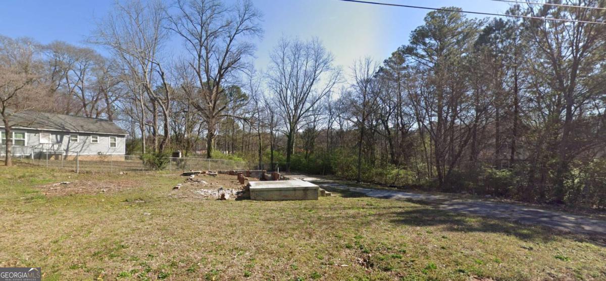 Discover a prime opportunity at 2500 Perkerson Rd SW, a vacant 0.23-acre lot situated in Atlanta's thriving Perkerson neighborhood. This R4-zoned property is level, cleared, and ready for development, with all utilities accessible. Ideal for builders, investors, or those dreaming of a custom home, this lot offers significant long-term potential in a rapidly growing and redeveloping market. Enjoy unparalleled convenience with close proximity to downtown Atlanta, Hartsfield-Jackson Airport, the Atlanta BeltLine, Tyler Perry Studios, and Lakewood Amphitheatre. This location perfectly blends urban amenities with a desirable neighborhood feel.