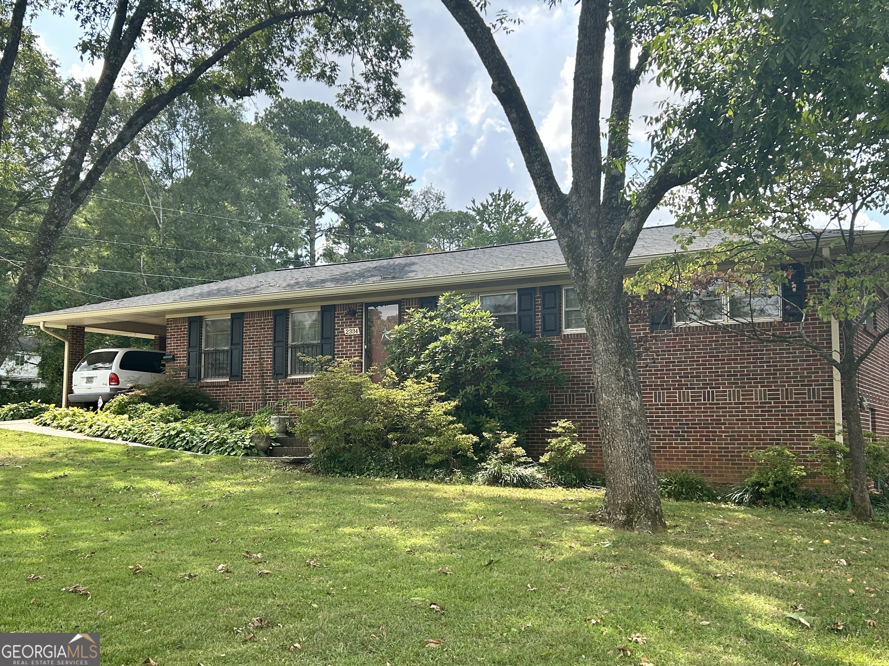 Charming All-Brick Home in East Point Welcome to this delightful and well-maintained all-brick home, nestled on an oversized lot that offers a blend of comfort, convenience, and charm. This property is designed to cater to all your living needs, with a combination of spacious interiors, functional features, and a beautifully serene outdoor space. Key Features of the Home * Spacious Bedrooms and Bathrooms: The home boasts 3 generously sized bedrooms and 2 immaculately tiled bathrooms, ensuring comfort and style for you and your family. * Elegant Flooring: Hardwood floors run throughout the home, adding warmth and sophistication to the living spaces. * Ample Living Areas: A living room and a large great room provide versatile spaces for relaxation and gatherings. The great room seamlessly connects to a naturally lit sun porch, offering stunning views of the oversized backyard and gardening area. * Outdoor Oasis: The backyard features a private well that supports a sprinkler system, making it ideal for gardening enthusiasts. The expansive outdoor area presents endless opportunities for landscaping and recreation. * Enhanced Protection: A gas Generac generator is included, ensuring your entire home remains operational during power outages. * Modern Roof: The roof is just 1 year old, offering peace of mind and long-term durability. * Detached Garage: The garage provides ample storage, workspace, and additional parking options. * Dual Basements: The home includes 2 separate basements with both interior and exterior access, adding flexibility and functionality. Location Benefits This home is situated in the heart of East Point, a charming and ethnically diverse urban community that blends the appeal of small-town living with big-city amenities. Residents, businesses, and visitors alike enjoy the area's light traffic and excellent accessibility, including proximity to highways, the MARTA bus and rail transportation system, and the airport. Highlights of East Point * Prime Accessibility: Located just five minutes from Hartsfield-Jackson Atlanta International Airport and 10 minutes from Downtown Atlanta. * Business and Shopping Hubs: Home to Camp Creek Marketplace, Camp Creek Business Center, and South Meadow Business Park, East Point attracts several Fortune 500 companies. * Unique Attractions: The city features the State's only Velodrome, a historic downtown district, and a vibrant array of local amenities. * Connectivity: East Point offers affordable living while being connected to endless opportunities to learn, live, work, and play. Why Choose This Home? This property is not just a house; it's an invitation to a lifestyle of convenience, charm, and community. Whether you're looking for a peaceful retreat or a place close to urban opportunities, this home in East Point delivers it all. Don't miss the chance to make this exceptional property your own!