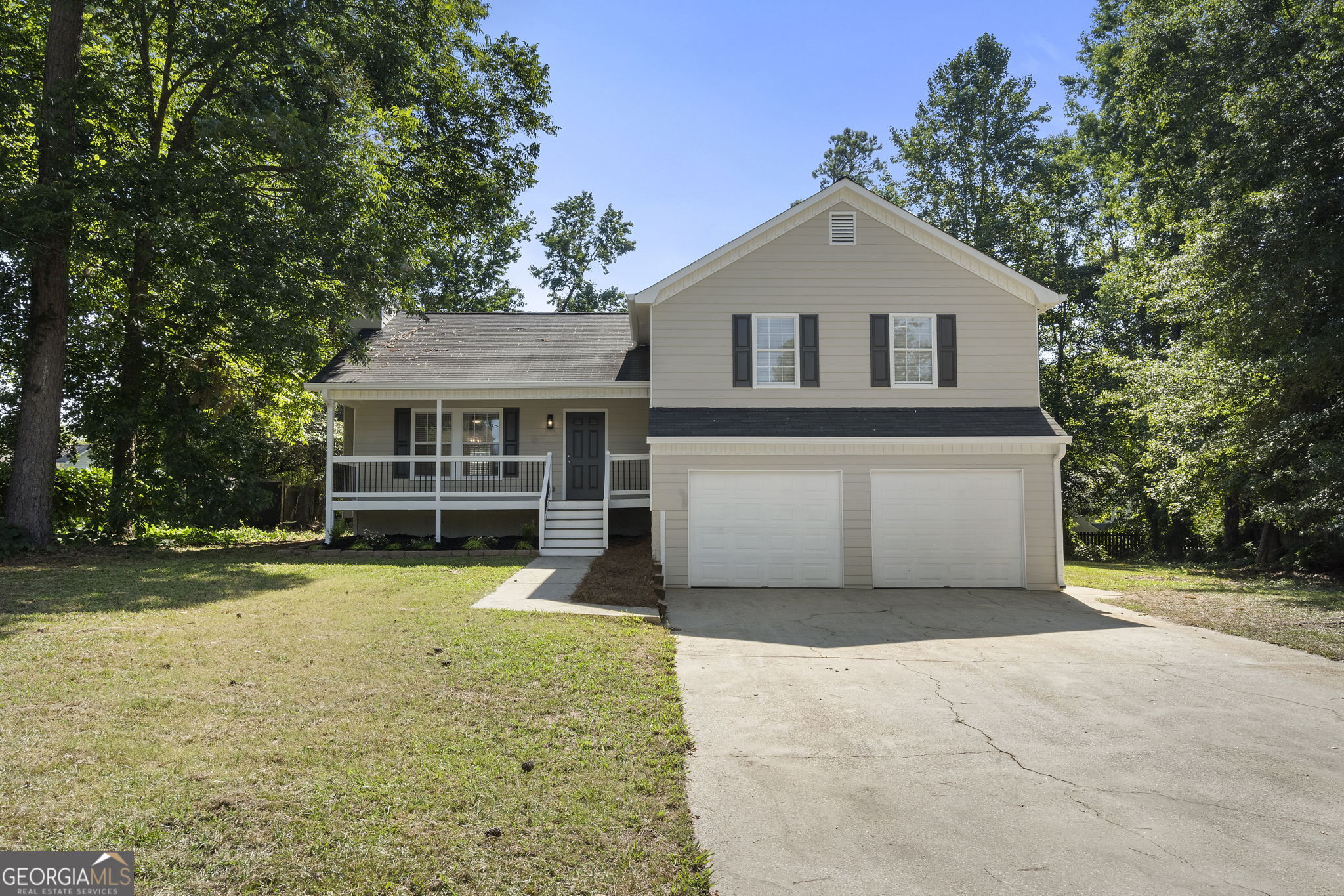 Just Listed! This beautifully remodeled split-level home offers 4 bedrooms and 2 full bathrooms on a spacious, private lot-perfect for those seeking comfort and style. The updated kitchen features white cabinets, granite countertops, a subway tile backsplash, and brand-new stainless steel appliances. Enjoy fresh LVP flooring and modern light fixtures throughout the main level, with new carpet in the bedrooms and durable LVP in the primary suite. The interior has been freshly painted, giving the home a clean, contemporary feel. The spacious primary bedroom includes a walk-in closet and a stunning en-suite bath with a tiled standing shower, tile floors, and a brand-new dual vanity. Outside, the freshly painted exterior complements a large, level backyard-ideal for entertaining or creating your own private retreat. No HOA! Move-in ready and full of upgrades, this home won't last long!
