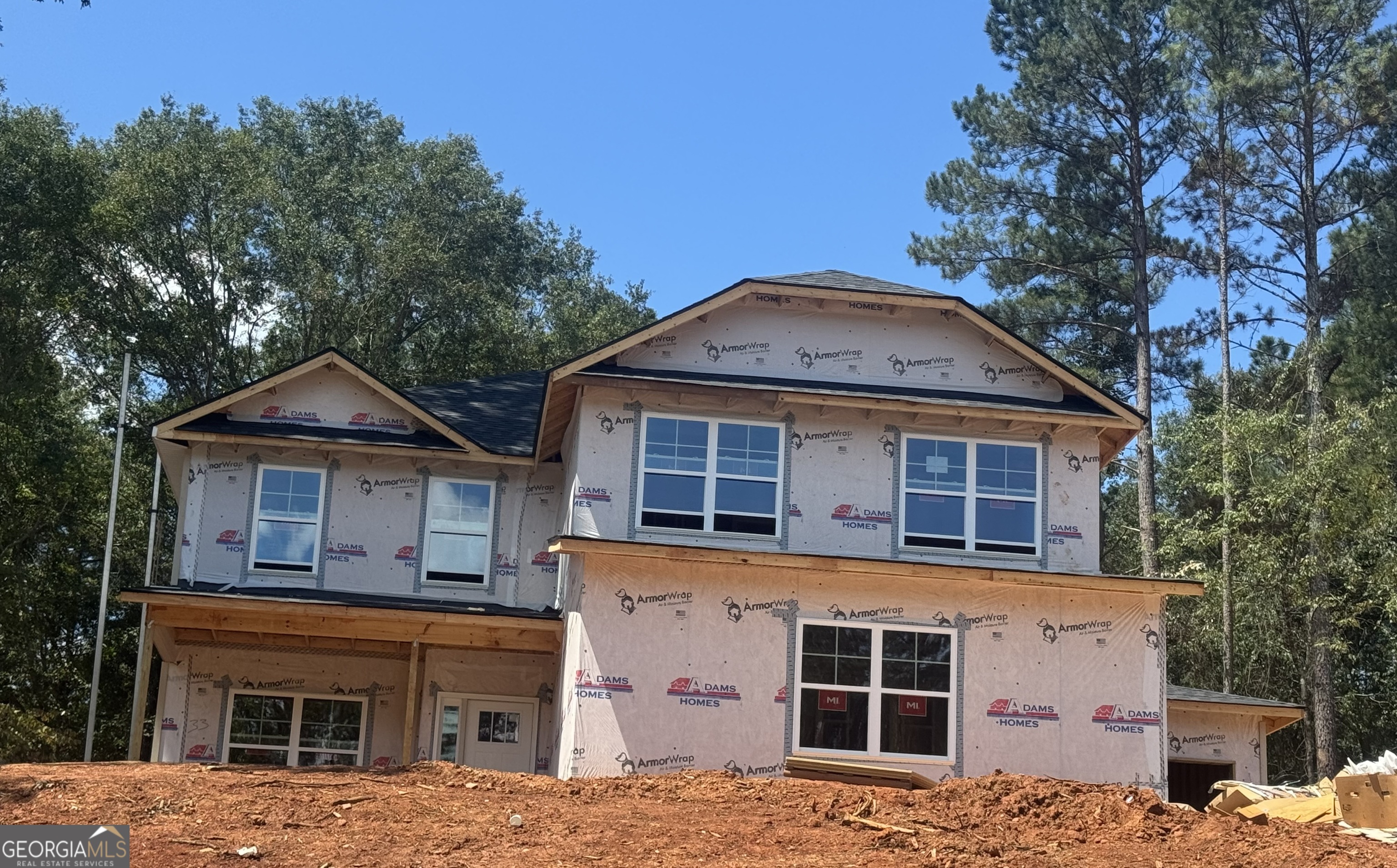 New Construction Home located in the picturesque foothills of the Northeast Georgia Mountains, The Fields of Walnut Creek offers the perfect blend of Southern charm and modern convenience. This vibrant community invites you to enjoy the best of farm-to-table dining, acclaimed wineries, and a variety of outdoor adventures in the tri-state area of Georgia, North Carolina, and South Carolina. The 2628 2-story Plan provides thoughtful design and stylish details. The kitchen is a standout with designer-painted white cabinetry, granite countertops, a tile backsplash and pendant lighting over the island. The premium lot includes a two car side entry garage, a one car front entry carriage garage, electric fireplace, exterior flood lights and extended 16 x 14 covered Lanai with a ceiling fan. The owner's suite features a spa-inspired 5ft Sterling shower with a glass door, double vanities, designer light fixtures & spacious walk-in closet. Additional highlights include luxury vinyl plank flooring in key areas. Bedroom living spaces are carpeted for comfort. Your home also comes with peace of mind: a 1-year builder's warranty, a 2-year systems warranty, a 10-year structural warranty, and two pre-closing walk-throughs. Plus, enjoy the convenience of a Smart Home Package to keep you connected and secure. Additional preferred Lender incentives available. Don't miss your chance on a beautiful new home in The Fields of Walnut Creek with a budget friendly HOA. The Fields of Walnut Creek is convenient to dining, shopping and easy access to I-985 and I-85. Check out our beautiful, decorated model home for current design trends. ***Please Note Stock Photos are used for illustration purposes only and may not represent actual home.*** Home is 20% Complete.