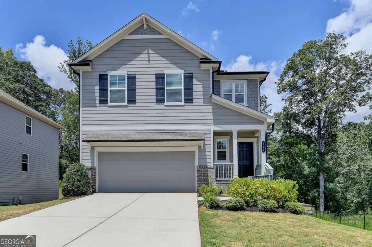 LOCATION! LOCATION! Just 3 minutes from I-85 in vibrant Braselton Downtown! Don't miss this stunning, 2022-built single-family home featuring the popular Atlanta Plan with a full basement-the only basement home in the entire neighborhood-and a private wooded backyard. All-new interior paint throughout, including deck areas. No carpet-entire home upgraded with brand-new waterproof LVP flooring. Stylish accent walls that add depth and character. Open-concept layout with spacious closets. Second-floor loft area, perfect for a home office or media space. This home shows like a brand-new model! Conveniently located near shopping, dining, and parks, it offers the perfect blend of comfort and accessibility. NO RENTAL CAPS! Opportunities like this don't last-schedule your showing today!