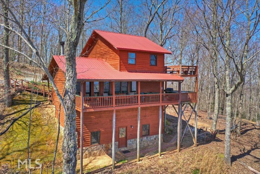 Head in the clouds… Pack your bags; it's time to go up, up, & away! Located on the outskirts of BR w/ amazing scenery leading the way, this cozy cabin has everything you need for your weekend retreat or rental investment starting w/ the dreamy yr-round mtn & pasture views! This stunning view just sets the stage; this lovely cabin comes furnished & boasts great rental history. It is easily accessible from all that NGA has to offer. Delight in the abundance of outdoor space whether on the porches or gathering w/ family & friends around the firepit. The floorplan is perfect for entertaining, & it features a great rm w/ stone fp, an abundance of glass allowing you to soak in the view from indoors, an abundance of “rustic” lodge style accents & full fin. bsmnt.