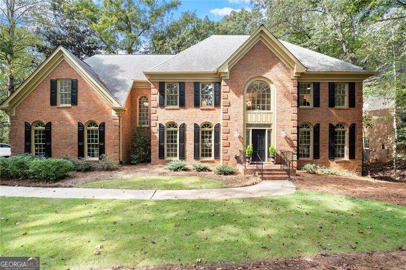 Stately 5-Bedroom Brick Traditional on Private Cul-de-Sac Lot in highly desireable Northcliff! Beautifully updated and move-in ready, this classic brick home offers 5 spacious bedrooms and 4 full baths. Enjoy refinished hardwood floors and fresh interior and exterior paint throughout. The inviting main level features a formal dining room, private home office with French doors, and an open-concept kitchen with a large island, stainless steel appliances, eat-in breakfast area, and walk-in pantry. The family room centers around a cozy fireplace and opens to an oversized back deck overlooking an expansive, fenced, wooded backyard-perfect for entertaining or relaxing in privacy. Upstairs, the oversized primary suite includes a sitting room, double vanities, soaking tub, separate shower, and generous walk-in closet. Secondary bedrooms are large and include a convenient Jack-and-Jill bath. The finished terrace level offers a second fireplace, additional bedroom and full bath, and access to a covered patio. Other highlights include a side-entry garage, back stairs, and a peaceful cul-de-sac location.