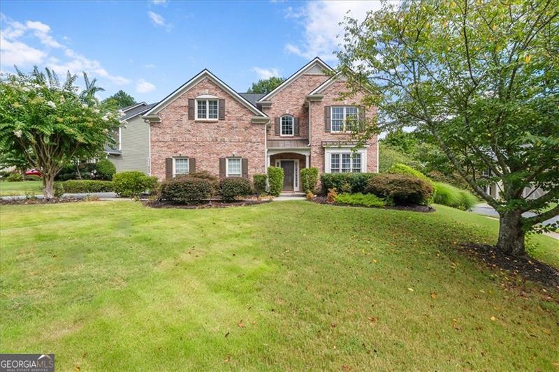 Welcome Home to Comfort, Charm, and Convenience! This beautifully maintained, one-owner home offers timeless elegance and modern comfort in an established Cobb County community. From the moment you enter the double-story foyer, you'll feel the pride of ownership throughout. The main floor features a formal living room and dining room with chair rail accents. It's perfect for entertaining. The spacious family room boasts a cozy fireplace and dramatic two-story windows that flood the space with natural light. The open concept kitchen overlooks the family room, creating the perfect gathering space. A bedroom and full bath on the main level offer flexibility for guests, in-laws, or a home office. Upstairs, you'll find a spacious owner's suite with trey ceilings, a relaxing sitting area, and a luxurious bath featuring double vanities, a soaking tub, and a large custom walk-in closet with built-ins. The secondary bedrooms are generously sized, including a Jack-and-Jill bath and a catwalk overlooking the elegant foyer and family room below. Situated on a desirable corner lot, the beautifully landscaped yard is a true gardener's paradise. It's bursting with flowers that bloom throughout the year. A Must See.