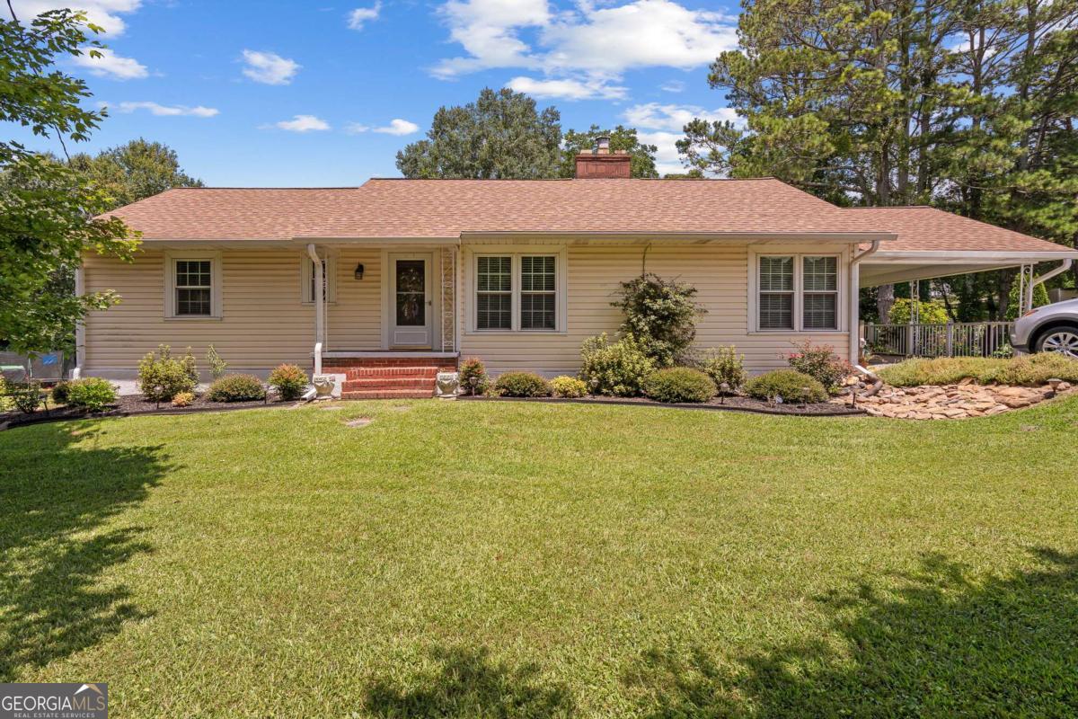 This beautifully updated, 2 bedroom 2 bath, ranch style house is bursting with character and modern touches throughout! With a spacious living room, cozy fireplace, and a separate dining room you won't want to leave. Hardwood floors, stainless steel appliances, and inviting layout were a must! Book a tour today to see where charm meets convenience right in the heart of Bowdon.