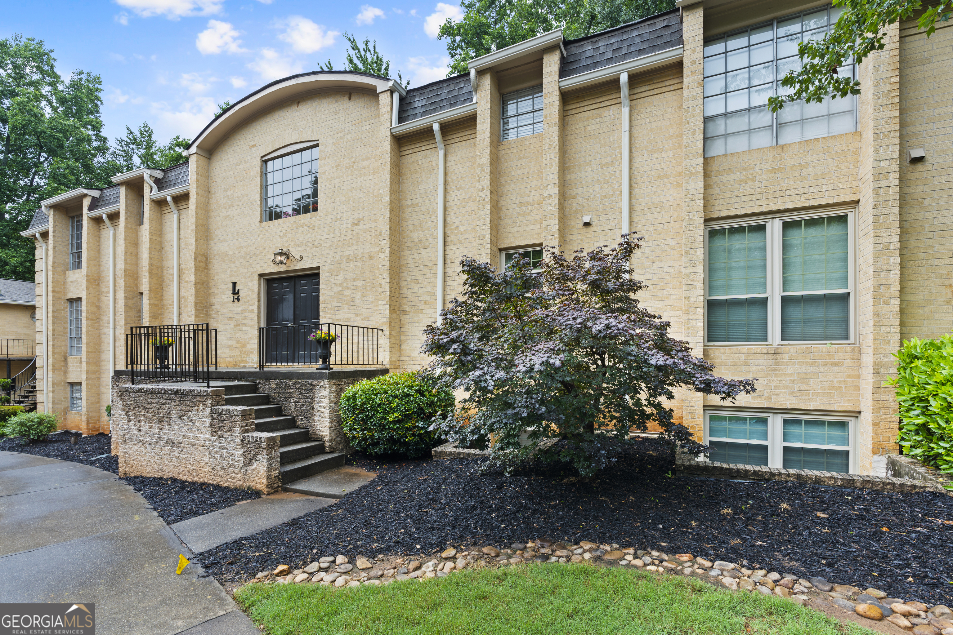 This well-maintained first-floor condominium offers comfortable, low-maintenance living with stylish hardwood floors throughout. Featuring two spacious bedrooms and two full bathrooms, this home combines convenience with charm. Enjoy nature with your own private patio with it's extended deck. The seller has updated the windows and patio sliding doors. Located just minutes from Atlanta and shopping centers, it's perfect for anyone seeking easy access to urban amenities. The community boasts a range of desirable amenities, providing a lifestyle of comfort and ease. Don't miss this opportunity to own a move-in ready home in a highly sought-after location!