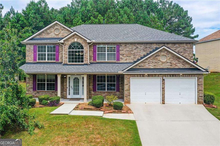 Welcome to this beautiful move-in-ready home in the desirable Preserve at Travers Creek, a quiet HOA community in Conyers, Rockdale County. This spacious 4-bedroom, 3-bath home sits on a premium corner lot and features fresh paint, new carpet, a new roof, and modern light fixtures. Inside, enjoy hardwood floors in the living areas and plush carpet in the bedrooms. The main floor includes a formal living room, dining room, and open-concept kitchen and family room with a cozy fireplace, plus a guest bedroom and full bath. Upstairs, the large primary suite boasts a sitting area, walk-in closet, and an en-suite bathroom with dual vanities. Additional highlights include a freshly painted garage and exterior. This home offers comfort and style in a great location near schools, shopping, and dining. Don't miss this opportunity!