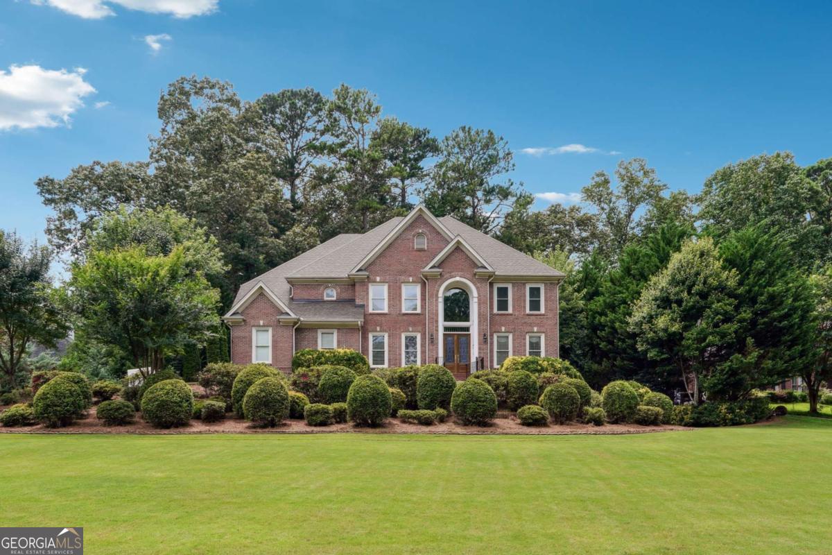 Exquisite Executive Residence in the Coveted Parkview High School District Welcome to this stately brick estate, thoughtfully designed with luxury, space, and sophistication in mind. Upon entry, you are greeted by a dramatic two-story foyer adorned with a tiled entryway and gleaming hardwood floors that extend throughout the main level. The home features a formal dining room with extensive trim detail, designer lighting, and an elegant ambiance ideal for entertaining. Opposite the dining room is a separate formal living room or home office, perfectly suited for today's versatile lifestyle. The grand two-story family room boasts architectural archways with mirrored accents, custom built-in cabinetry, and a stunning marble fireplace, all framed by executive-style trim and coffered ceilings. The expansive eat-in kitchen features a charming bay window bump-out, flooding the space with natural light. A true chef's kitchen, it includes a counter-depth refrigerator, abundant custom cabinetry, premium countertops, high-end appliances, sophisticated lighting, and a generously sized walk-in pantry. The oversized primary suite offers a tranquil retreat with a private sitting area, double recessed tray ceiling with crown molding, and abundant windows. The luxurious en-suite bath includes a large garden tub, dual vanities, a spacious tiled shower with built-in bench, and an expansive walk-in closet. Secondary bedrooms are generously proportioned, including one with a private full bath and walk-in closet, and two additional bedrooms connected by a Jack-and-Jill bath with separate vanities-each with excellent natural light and ample storage. A large linen closet and a sprawling laundry room with built-in shelving provide functionality and organization. The open staircase leads to a fully finished terrace level, which includes a sprawling entertainment room with custom cabinetry, a media room, a guest suite with a walk-in closet and private full bath, and a convenient half bath. Additional unfinished areas offer workshop space, built-in shelving, and house recently updated mechanical systems-including a water filtration system-ideal for hobbyists or extra storage. This exceptional residence offers refined living with timeless design and is truly a must-see for the discerning buyer.