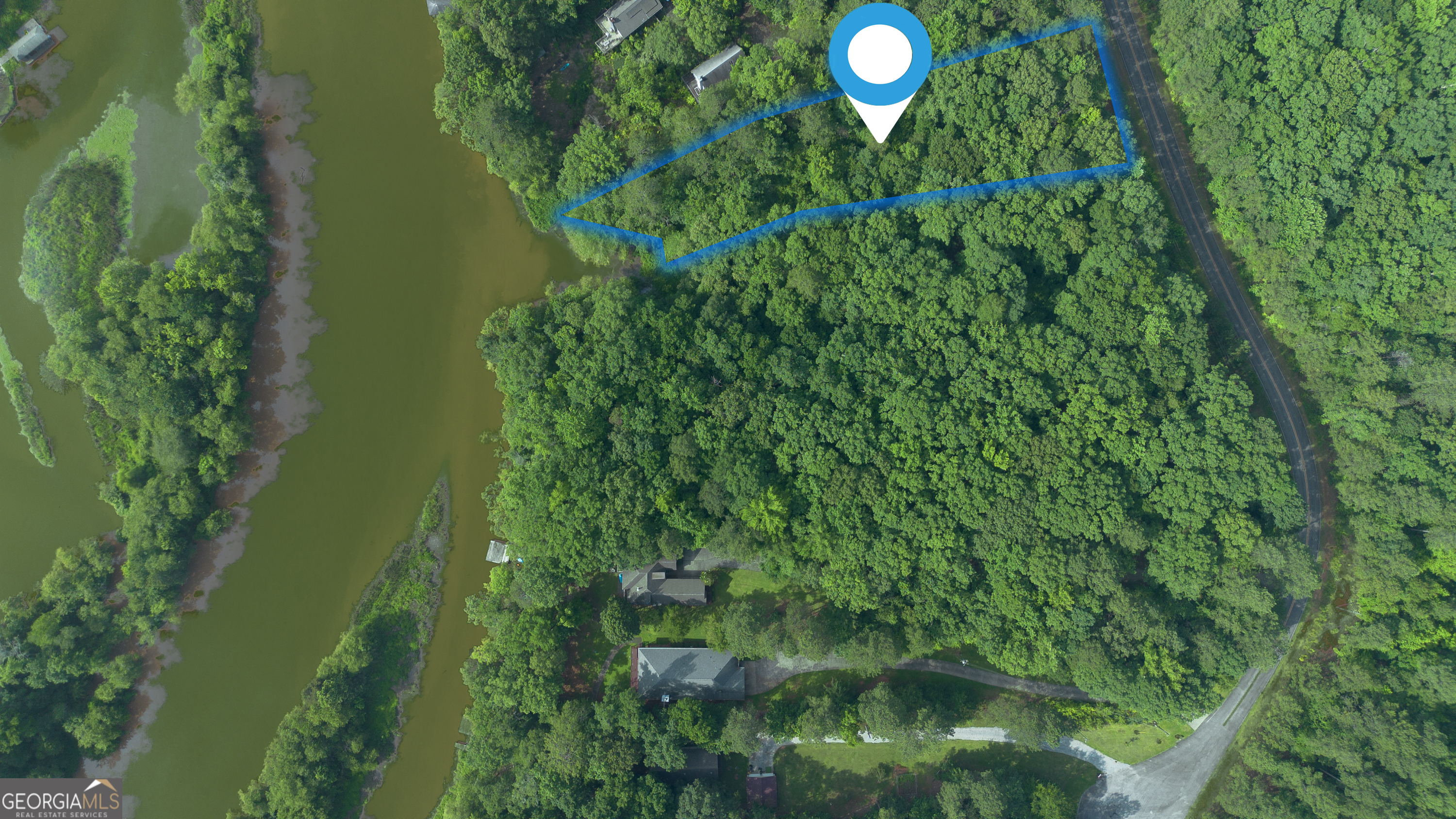 Looking for peaceful lake views without the high price of waterfront? This gently sloped and wooded fee simple lot on Lake Sinclair offers partial lake views and easy access to the water for kayaking, paddle boarding, or simply enjoying the serenity of lakeside living. This property is an ideal spot to build your dream home, weekend getaway, or investment retreat. If you're seeking a quiet spot with views, light recreation, and tons of potential, this one is priced right and ready for you!
