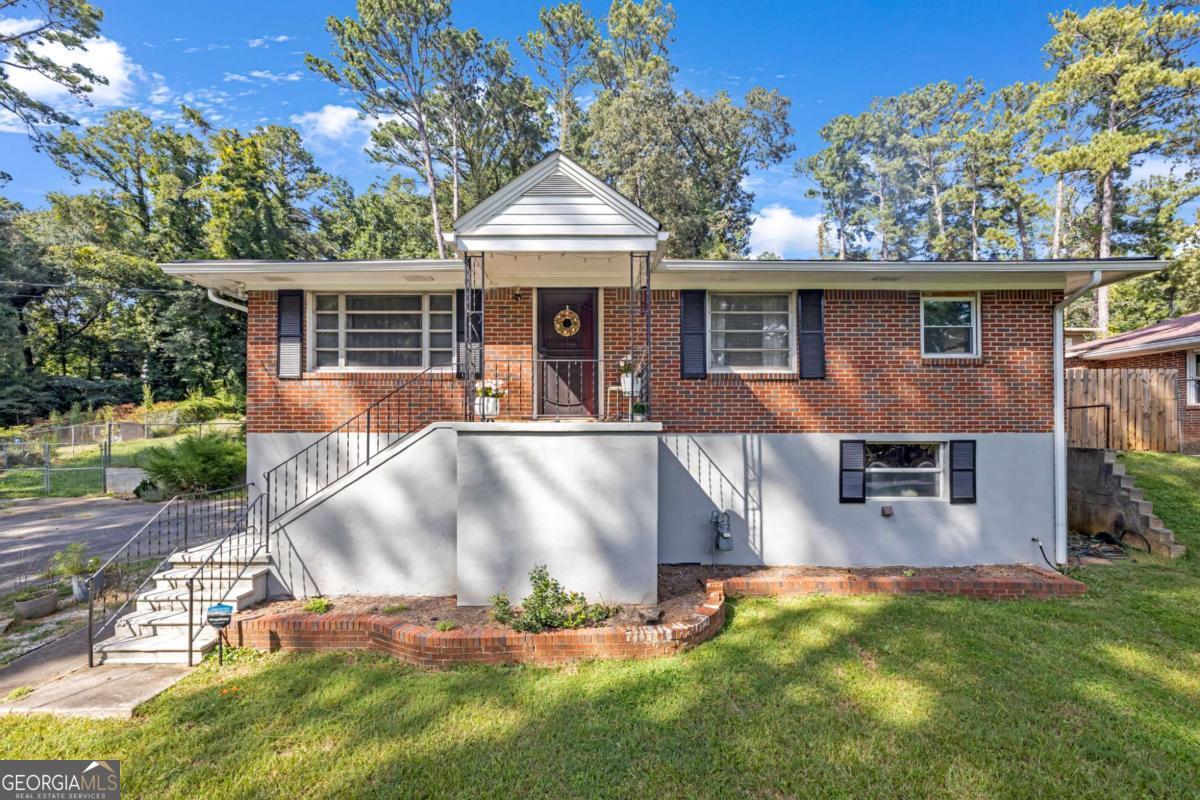 Check out this cute and cozy 2-bedroom, 1-bath home that is full of potential! Perfect for first-time buyers or investors! Located in the heart of Atlanta, this property features a super spacious front yard and a basement garage with plenty of storage or workshop space! The bones are good! Solid structure, ready for your personal touch - sold as-is! The seller is motivated - bring all offers! Whether you're looking to buy your first home or invest in a growing area, this is a great opportunity to own property in Atlanta. Don't miss out!
