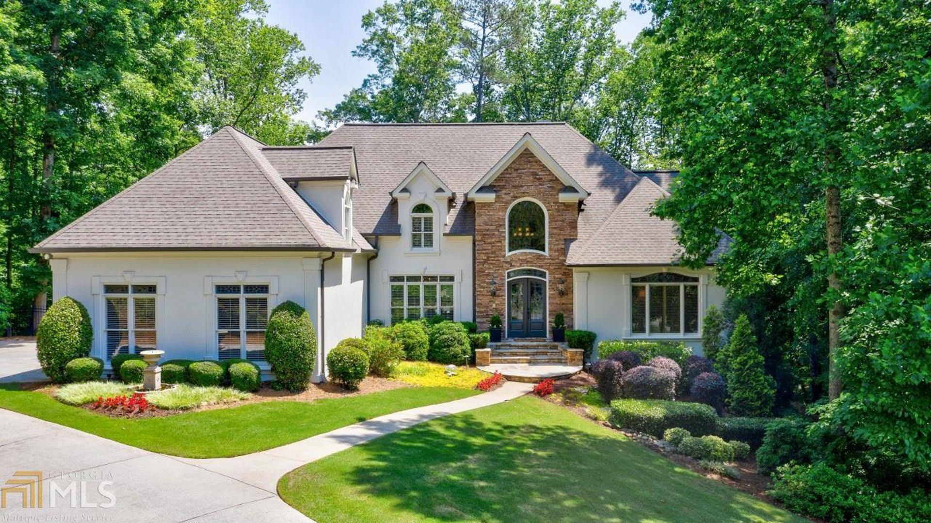 Spectacular home on 2 acres in Wilson Glen, A secluded enclave in the heart of Roswell. Sunshine-filled open & spacious living. Beautifully renovated master retreat w/spa-like bath & custom closet. All secondary bedrooms are en suite. Updated kitchen features oversized breakfast island w/ gorgeous granite & is open to the cozy keeping room. Incredibly finished Terrace Level is perfect for entertaining & hosting family & friends (includes bar, family room, game room, fitness room, bedroom, full bath, sauna, wine closet, craft room and plenty of storage)! Walk out to one of the most beautiful and tranquil backyard oasis in Roswell featuring saltwater pool & Jacuzzi. Close to public & private schools, Canton Street and area parks.