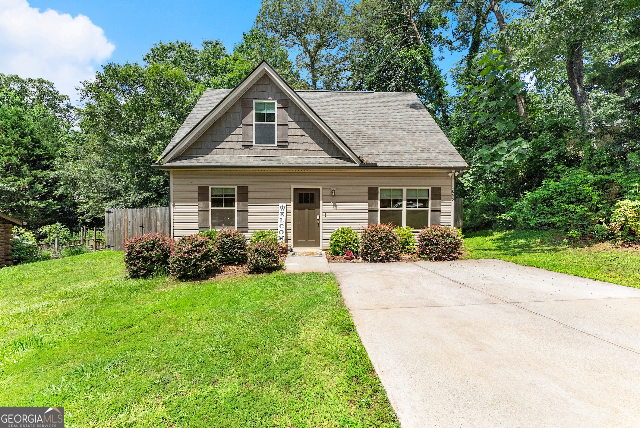 No HOA! Welcome to this charming and beautifully updated 3-bedroom, 2.5-bath home located in scenic middle Forsyth County. Thoughtfully designed with comfort and functionality in mind, this home features an open floor plan that seamlessly connects the living, dining, and kitchen areas, making it perfect for both everyday living and entertaining. The eat-in kitchen boasts stainless steel appliances, granite countertops, ample cabinet space, and large center island with additional seating-ideal for casual meals or hosting friends and family. The open layout ensures you can stay connected with guests while cooking, and direct access to the patio allows for effortless indoor-outdoor entertaining. The Master on main offers a relaxing retreat with an en-suite bath featuring granite double vanities, a bath/shower combo, and walk-in closet. Upstairs, two secondary bedrooms and a full bath provide plenty of space for a growing family, overnight guests, or a home office setup. The private, fenced backyard is perfect for pets, gardening, or simply enjoying peaceful outdoor moments. Additional highlights include updated finishes throughout, modern fixtures, and neutral tones ready for your personal touch. Whether you're a first-time homebuyer, a growing household, or a retired couple looking to downsize without sacrificing quality, this home checks all the boxes. Located just minutes from GA-400, top-rated Forsyth County schools, shopping, dining, medical facilities, parks, and the recreational paradise of Lake Lanier, this property combines comfort, convenience, and lifestyle in one outstanding package.