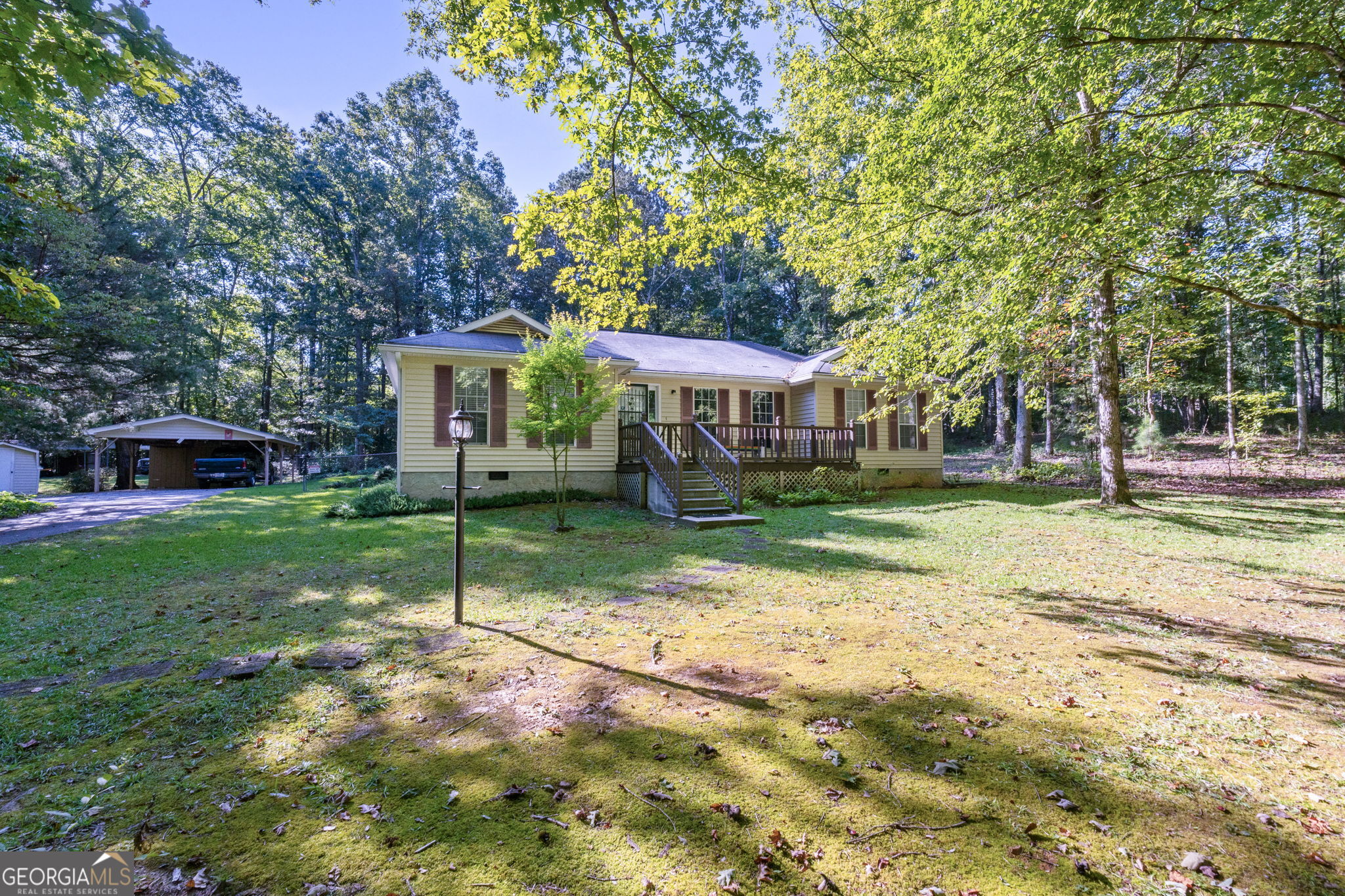 This charming ranch home sits on a tranquil 3.87cre lot, offering the perfect blend of peaceful country living and convenient access to modern amenities. Surrounded by nature, the property boasts a serene atmosphere with lush greenery, mature trees, and open spaces, making it an ideal retreat for those seeking both privacy and natural beauty. The single-story home is thoughtfully designed for comfort and easy living, featuring an open-concept floor plan with spacious living areas and large windows that bring in abundant natural light. The home includes spacious bedrooms, a cozy living room, and a fully equipped kitchen . The expansive 3.87 acre lot offers plenty of room for outdoor activities, gardening, or simply enjoying the beauty of the surrounding landscape. A detached outbuilding provides additional storage or workspace, ideal for hobbies or projects. Despite the peaceful and private setting, the property is conveniently located close to shopping, dining, and top-rated schools, offering the best of both worlds. This ranch home is the perfect place to enjoy a serene lifestyle, while still being just minutes away from all the conveniences of suburban living. Whether you're relaxing in the backyard or exploring nearby parks, you'll find endless opportunities to connect with nature in this idyllic setting.