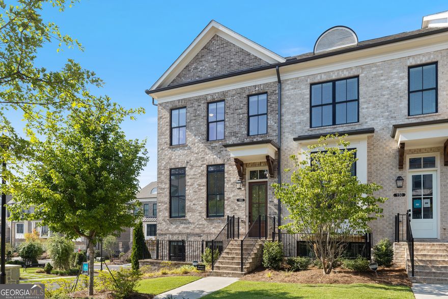 From the vibrant energy of Avalon to the charm of Downtown Alpharetta, few places capture the best of both worlds quite like Towns on Thompson and 160 Briscoe Way is right in the heart of it all.  Welcome to The Chamberlain, a designer-curated, end-unit luxury townhome that effortlessly blends modern sophistication with everyday comfort. Perfectly positioned along the Alpha Loop, this home offers an unmatched walkable lifestyle where coffee runs, date nights, and Saturday strolls are all just steps from your front door.  Inside, you'll find 10-foot ceilings and hardwood floors throughout, setting the stage for open, light-filled living. The chef's kitchen is a showpiece, stacked white cabinetry, matte black hardware, a herringbone backsplash, quartz island, and 36" commercial-style range anchor a space designed for both daily life and effortless entertaining. The sun-soaked dining area flows seamlessly into the living room, where a shiplap fireplace adds warmth and texture. Need a quiet spot to work or unwind? A flex sunroom just off the living area opens to a covered rear deck, perfect for morning coffee.   Upstairs, retreat to your private owner's suite, complete with a sitting area, deck access, custom walk-in closet, and a spa-inspired bath featuring a freestanding soaking tub, frameless glass shower, and dual vanities. A spacious secondary bedroom with en-suite bath offers privacy for guests or family.  The terrace level features a full bedroom and upgraded bath that's ideal for guests, in-laws, or a stylish home office, plus a clever hideaway nook under the stairs, perfect for pets or storage.  Every inch of this home was designed with intention from oversized 7' windows that flood the space with natural light, to the thoughtful end-unit privacy and extra windows that make every room feel open and airy.  Towns on Thompson is a boutique 48-home community, offering low-maintenance luxury living. HOA covers landscaping, exterior maintenance, structural insurance, termite bond, trash/recycling, and more. Optional swim amenities available at The Foundry.  When location, design, and lifestyle align this perfectly, it's not just a home, it's the one you've been waiting for.