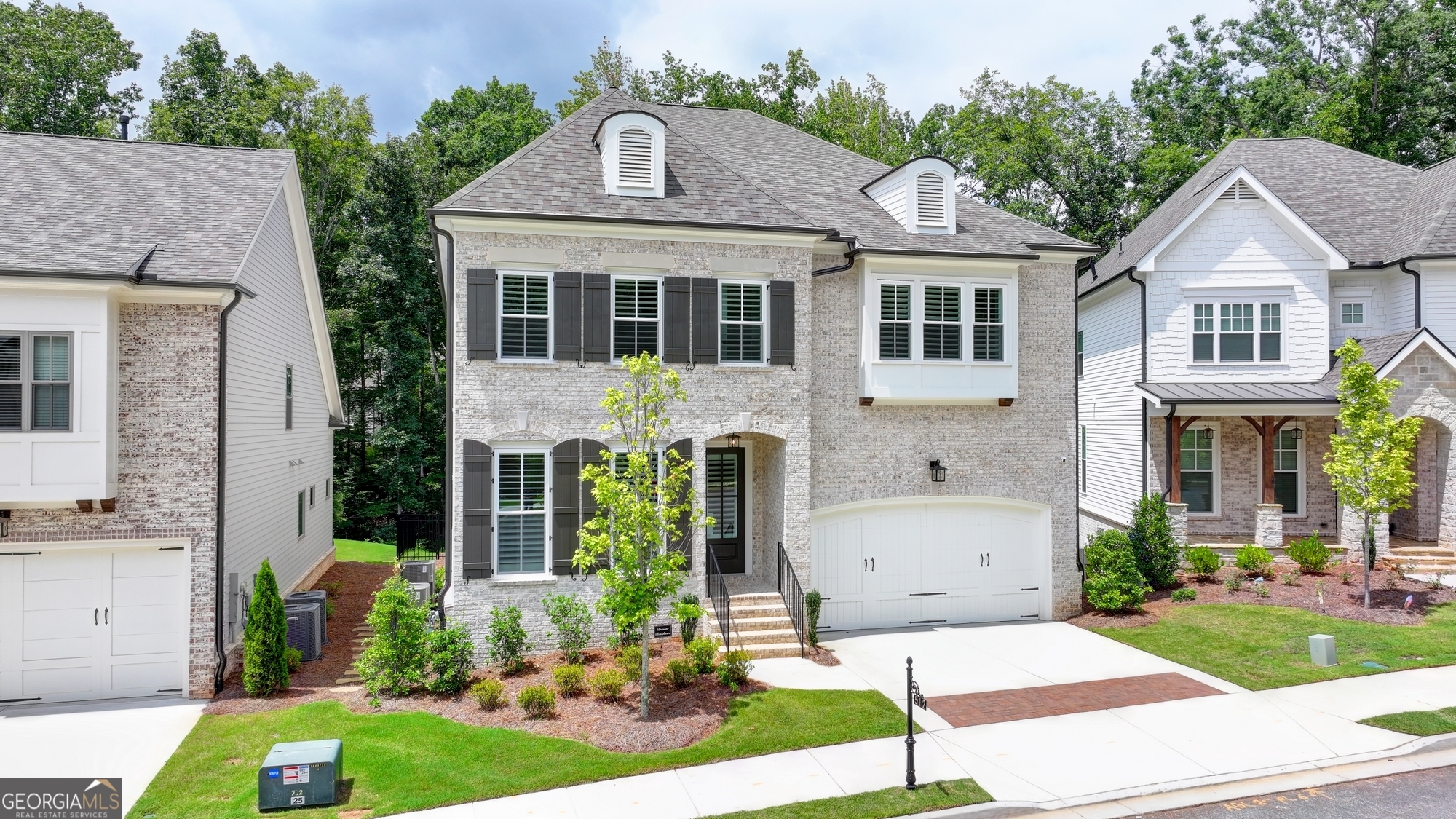 Stunning 6-BEDROOM, 5-BATH home with professionally finished terrace level and over $300K in upgrades combines modern OPEN-PLAN design and exquisite finishes throughout ON A PRIME CUL-DE-SAC LOT. This 8-MONTH-OLD home feels brand-new and features high-end upgrades on all 3 levels. LARGEST FLOOR PLAN in Bellmoore Park in the latest phase and one of two last remaining basement lots! Step through the front porch into the light-filled foyer and into the OPEN PLAN living space where soaring 12-FOOT CEILINGS and FLOOR-TO-CEILING, MODERN WINDOWS flood the space with natural light. The stylish FAMILY ROOM features custom shelving and cabinetry, and a CONTEMPORARY LINEAR FIREPLACE with glass doors. This space also features an inviting family-sized DINING AREA with crown and chair rail molding. The gourmet kitchen is perfect for the family chef and features CUSTOM LIGHTED CABINETRY, QUARTZ countertops, HIGH-END STAINLESS STEEL GE MONOGRAM APPLIANCES, a massive central ISLAND ideal for entertaining, a WINE FRIDGE, and an oversized WALK-IN PANTRY WITH BUILT-INS. The BREAKFAST ROOM/SUNROOM opens to a SPRAWLING DECK-perfect for morning coffee or hosting family and friends. Steps from the deck provide easy access to the terrace level and patio. The main floor also features a BEDROOM/OFFICE with custom closets and a full bath with tiled floor and shower and custom vanity with Quartz countertop. The MUDROOM is thoughtfully designed with built-in storage for everyday convenience. Upstairs, the MASTER SUITE boasts a tray ceiling, crown molding and a custom-designed spa bath with tile floor and shower with frameless glass surround, FREESTANDING SOAKING TUB, double vanities with Quartz countertops, and a separate vanity/makeup station. The EXPANSIVE WALK-IN CLOSET features custom cabinetry, creating a boutique-like dressing space. Three additional generously-sized upstairs bedrooms and 2 full, tiled bathrooms with tile floors and showers and custom cabinetry with Quartz countertops and all closets feature CUSTOM CABINETRY. A LAUNDRY room with SINK and custom cabinetry makes organization effortless. The professionally finished TERRACE LEVEL is an entertainer's dream, complete with a WET BAR with stainless steel wine fridge, microwave and refrigerator, expansive GAME ROOM, and additional LIVING/FLEX area. This huge space also features a private BEDROOM/EXERCISE ROOM with barn door and full, tiled bath with frameless glass shower and quartz countertop. Step into the beautiful SCREENED-IN PORCH and patio opening to the LEVEL, FENCED, LANDSCAPED BACKYARD, all overlooking a peaceful creek and woods that create the ultimate in PRIVACY. The HIGH-END UPGRADES in this beautiful home include a whole-home LUTRON LIGHTING SYSTEM, WAP NETWORKING for fast, seamless connectivity, RING CAMERAS and doorbell SECURITY SYSTEM, garage featuring dual EV OUTLETS, epoxy garage floor and a full closet and storage rack system. CUSTOM CLOSETS and plantation shutters throughout the home and energy-efficient modern windows for optimal light and privacy set the tone for luxury living, while the open floor plan ensures effortless flow between rooms. Located in GATED, Bellmoore Park in the SOUGHT-AFTER NORTHVIEW HIGH SCHOOL district, this spectacular community features a resort-style POOL & CLUBHOUSE, FITNESS CENTER, TENNIS courts, PARK, BASKETBALL courts, playground, GRAND LAWN & is minutes from walking trails, shopping and dining. Close to TOP-RATED SCHOOLS, and all that Johns Creek has to offer-this property offers luxury, convenience, and security in one perfect package. Welcome home...