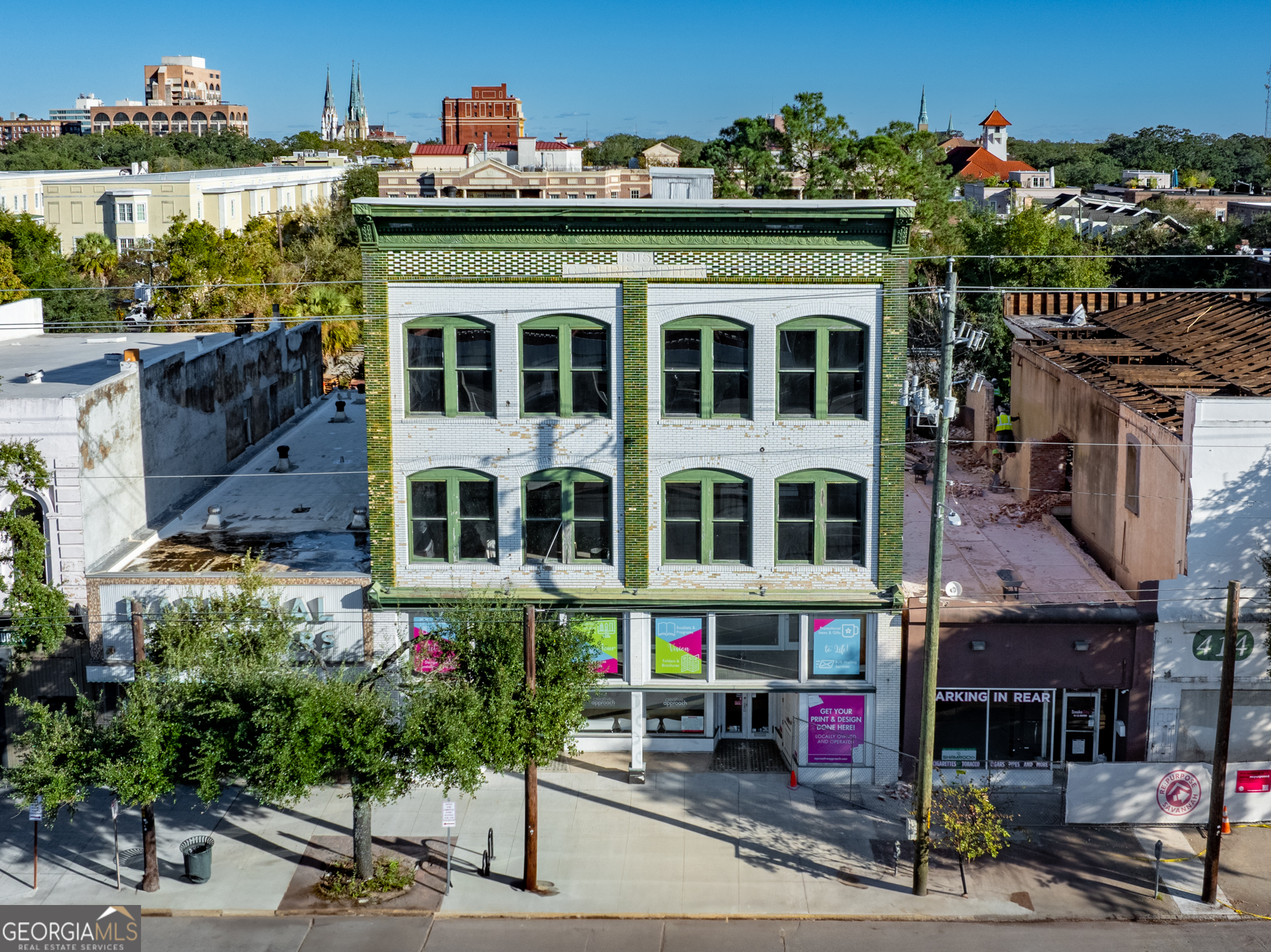 Great opportunity for redevelopment. Ground floor and basement are fully built out and would be ideal for Retail, Office or Restaurant. Upstairs are shells that could be redeveloped as additional offices, condos or rental units. Zoned Commercial and the sky is the limit. This space has been a creative location for over twelve years and is in an area that is alive with new development all around. From the upstairs and rooftop there are panoramic views of the Talmadge Bridge, Downtown Savannah and all the church steeples. Easy to show and prime for redevelopment. Easy access to I-16 and solid foot traffic with its proximity to The Savannah Visitors Center. One block south of Thrifty Center and easy walk to Downtown Savannah attractions.