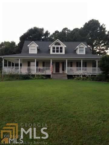 Beautiful Country Home Situated on approx 5 acres, Rocking chair front porch, Hardwood floors,Tile in Baths, Master on Main floor, In-Ground Pool, Private and located right off 278 Potential Short Sale, Must be approved by the bank