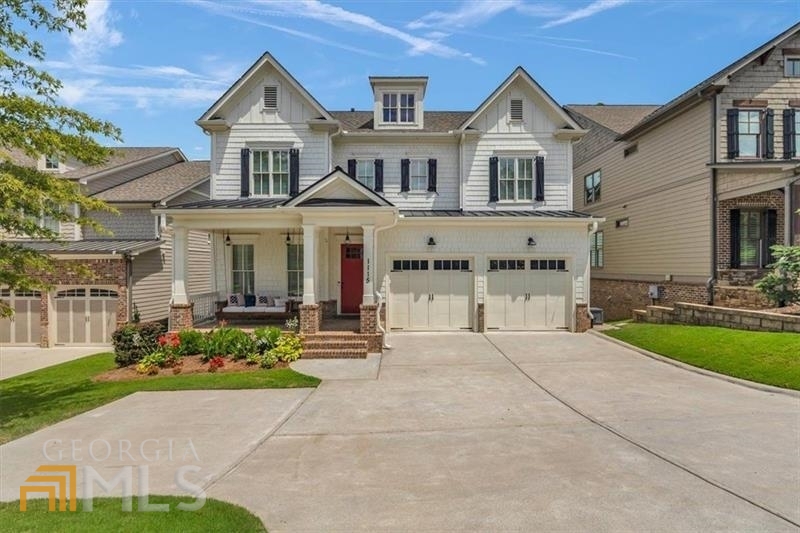 Exceptional Smyrna location, just two blocks from the Smyrna Market Village, this stunning custom-built craftsman home has the modern finishes with cozy craftsman feel that will make you kick off your shoes and enjoy life for a while. After a hard day at work, pull up to your house and enjoy a cocktail while swinging on your front porch and watching the sun set. Step inside and relish in all the home has to offer: 10ft ceilings, ship lap accent walls, crown molding, custom wainscoting, modern lighting, coffered ceilings, & stacked stone fireplace- not to mention gorgeous oak hardwood floors throughout the entire home.!The open floor plan is perfect for entertaining or watching children while you cook! The kitchen will ignite your inner top chef: farmhouse porcelain sink, granite counters, ceiling high cabinets, porcelain apron sink, stainless appliances, an impressive island, coffee bar, mud room for jackets & shoes and a walk-in pantry big enough to almost get lost in! Don't miss the barn door lined first floor bedroom, great for guests with an en suite bath. Head upstairs to the owner's suite to find even more beautiful lighting & a bathroom that will make you want to soak for hours. Separate his & her sinks with roomy his & her closets. Three more secondary bedrooms on this floor, and two more chic bathrooms to accommodate. Tons of storage throughout the house with fresh paint as well. Modern meets farmhouse in the ship-lap lined, barn door office /playroom! Need even more space? Although super rare in this prime Smyrna location, there's 1600sq ft of unfinished basement space to expand if needed (already stubbed and plumbed)! Last stop is outside - any type of living space you'd like: screened porch with stacked stone fireplace & mounted TV, open air deck, and lower level covered patio! Completely fenced in backyard with a colossal play set that will entertain for hours! Ready to really enjoy what Smyrna has to offer? You can now WALK to great dining, cocktails, the library, nature reserve pond with abundance of wildlife, playgrounds, outdoor concerts, fireworks, community center, & even a new brewery coming in 2023. Don't miss out on this rare opportunity with the absolute best location Smyrna has to offer! Book your showing today and fall in love!