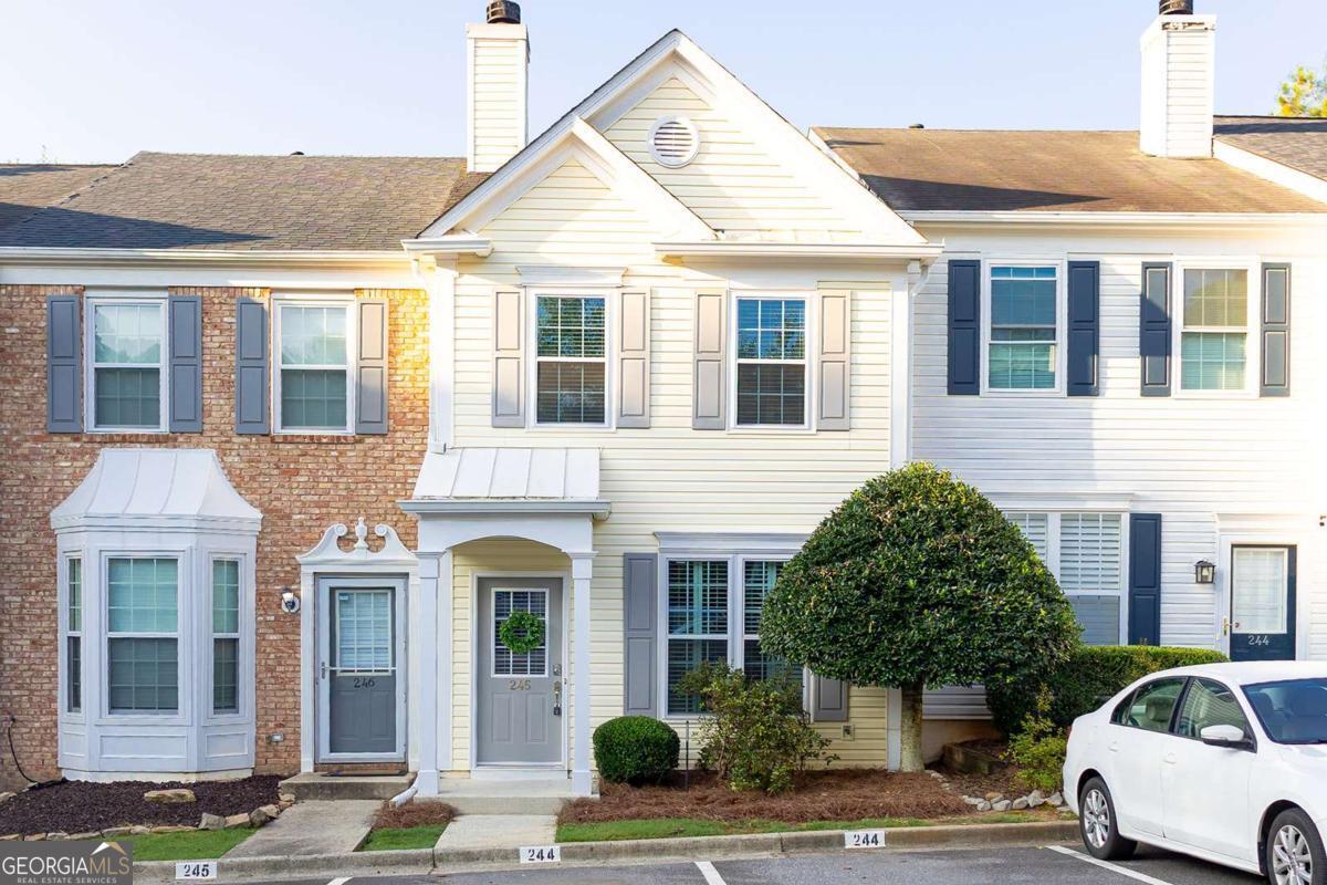 Beautifully updated townhome featuring 2 beds + 2.5 baths - the perfect blend of modern updates with cozy charm. Step into the heart of the home-an upgraded kitchen featuring NEW appliances, NEW quartz countertops, NEW white cabinets, NEW stylish backsplash, and NEW deep farmhouse-style sink. Whether you're hosting friends or cooking a quiet meal at home, this kitchen is designed to impress. Enjoy peace of mind with a BRAND-NEW HVAC system, NEW energy-efficient windows, and NEW sliding glass door. The water heater was replaced in 2023, adding even more value and reliability to this already move-in-ready home. Step outside to your private garden, ideal for growing vegetables, herbs, or creating a tranquil retreat, perfect for morning coffee or evening unwinding. Two assigned parking spaces offer convenience and ease every day. Abundance of Natural Light throughout. Don't miss this opportunity to own a lovingly updated townhome that offers low-maintenance living with modern upgrades and outdoor possibilities.
