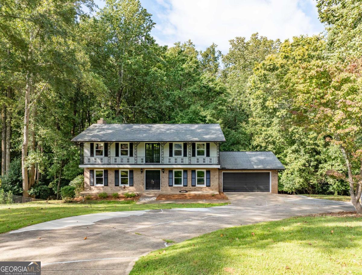 Nestled on a peaceful cul-de-sac in Gainesville, this beautiful 4-bedroom, 2.5-bath home offers the perfect blend of comfort, convenience, and location. Just minutes from downtown and close to Longwood Park on Lake Lanier, you'll enjoy easy access to recreation, dining, and entertainment-all within a top-rated school district. Inside, you'll find hardwood floors throughout, creating a warm and inviting atmosphere. The spacious layout features a bright living area, a functional kitchen, and four generously sized bedrooms. The private backyard is ideal for relaxing, entertaining, or simply enjoying the quiet surroundings. Additional highlights include a 2-car garage and the convenience of two full bathrooms plus a half bath. Whether you're looking for a friendly neighborhood or a peaceful retreat near downtown Gainesville and Lake Lanier, this home checks every box.