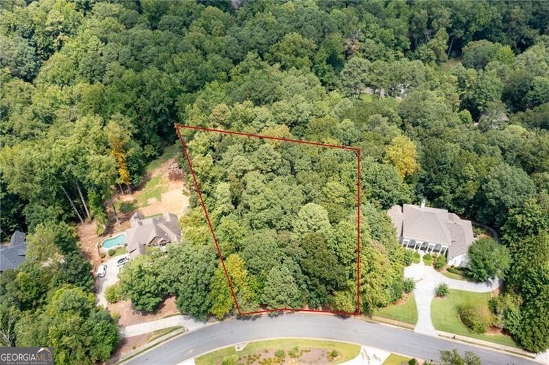 This is a rare opportunity to build your dream home in Keeler Woods! Tucked away in the heart of Marietta, this one-acre wooded lot offers the perfect canvas to build your dream home in one of the area's most established and desirable neighborhoods. This property provides a peaceful, private setting on a quiet street, with the convenience of being in the middle of all that Marietta has to offer. Just minutes from the Marietta Square, you'll have quick access to incredible restaurants, boutiques, farmers markets, and year-round events. Just as close, is Kennesaw Mountain National Park, offering miles of hiking trails and beautiful scenery. Opportunities like this don't come around often in this neighborhood-this is your chance to create a custom home in a truly exceptional location!