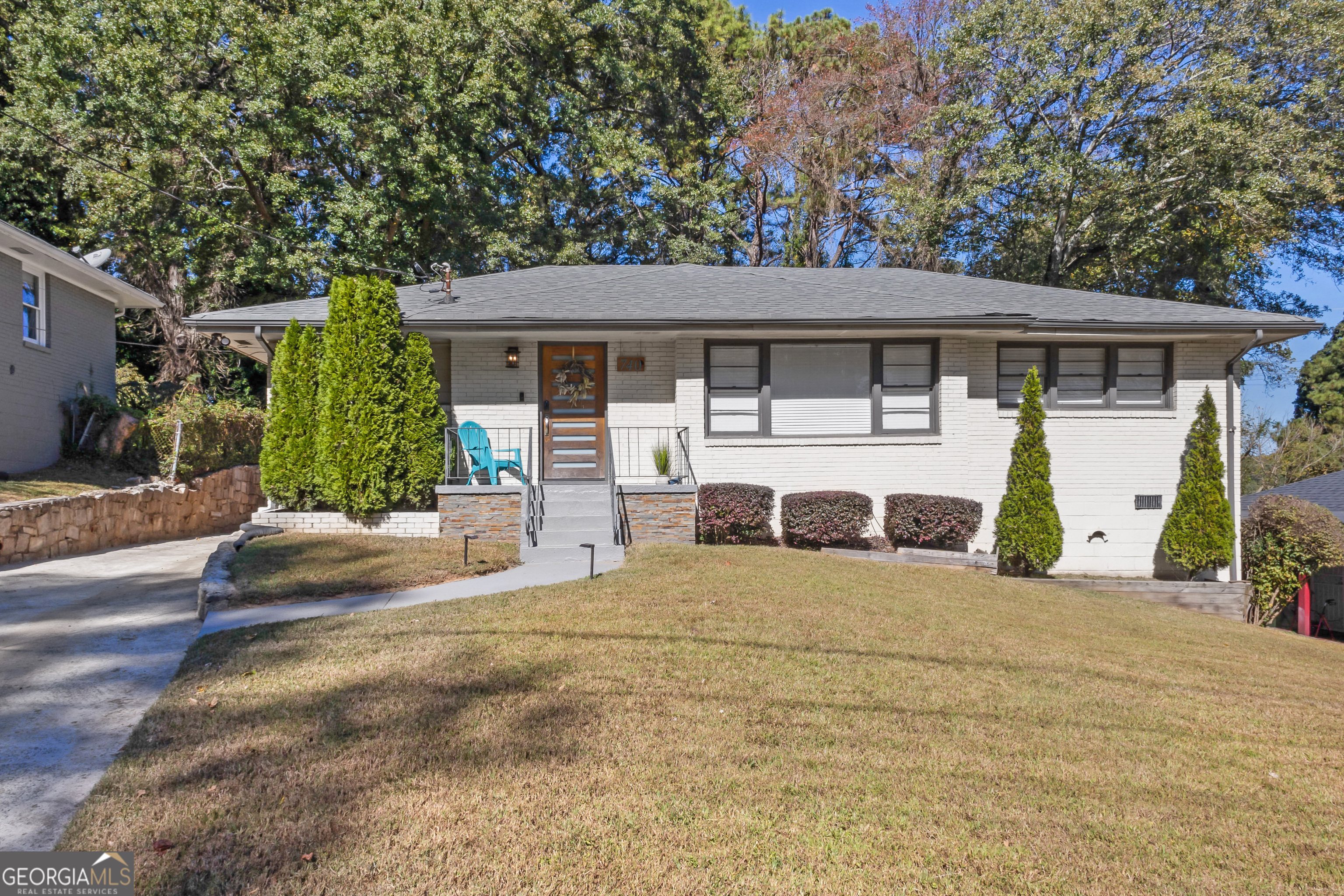 Welcome to 740 Custer Avenue, a beautifully updated home in Benteen Park-just south of Grant Park and only a mile from the BeltLine! This move-in ready brick ranch offers a perfect blend of modern upgrades and comfortable living and a flat, private backyard. Step inside to an open-concept layout connecting the living, dining, and kitchen areas-perfect for entertaining or keeping everyone connected. The kitchen offers granite countertops, ample cabinetry, and direct access to the back deck, making it easy to unload groceries or host gatherings with friends and family. Out back, a spacious parking pad provides plenty of off-street parking for you and your guests. Enjoy the outdoors in the spacious backyard-perfect for kids, pets, and weekend barbecues. Inside, you'll love the updated bathrooms, kitchen, and flooring (no carpet!), saving you the hassle of renovations. The primary suite is a true retreat, featuring a walk-in closet and a spacious ensuite bath with double vanities and a luxurious waterfall shower. A large laundry room just off the main living area adds extra convenience. Perfectly positioned near some of Atlanta's most beloved destinations, this home is just 5 minutes to Zoo Atlanta, 4 minutes to the BeltLine, and right next to Grant Park. You'll also enjoy quick access to East Atlanta Village and a smooth commute to the airport-making this location truly unbeatable. Whether you're looking for a starter home or a smart investment in an up-and-coming neighborhood, 740 Custer is ready to welcome you home.