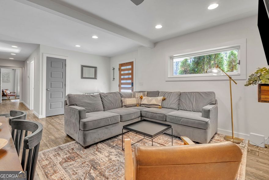Welcome to 740 Custer Avenue, a beautifully updated home in Benteen Park-just south of Grant Park and only a mile from the BeltLine! This move-in ready brick ranch offers a perfect blend of modern upgrades and comfortable living and a flat, private backyard.    Step inside to an open-concept layout connecting the living, dining, and kitchen areas-perfect for entertaining or keeping everyone connected. The kitchen offers granite countertops, ample cabinetry, and direct access to the back deck, making it easy to unload groceries or host gatherings with friends and family. Out back, a spacious parking pad provides plenty of off-street parking for you and your guests.    Enjoy the outdoors in the spacious backyard-perfect for kids, pets, and weekend barbecues. Inside, you'll love the updated bathrooms, kitchen, and flooring (no carpet!), saving you the hassle of renovations.    The primary suite is a true retreat, featuring a walk-in closet and a spacious ensuite bath with double vanities and a luxurious waterfall shower. A large laundry room just off the main living area adds extra convenience.     Perfectly positioned near some of Atlanta's most beloved destinations, this home is just 5 minutes to Zoo Atlanta, 4 minutes to the BeltLine, and right next to Grant Park. You'll also enjoy quick access to East Atlanta Village and a smooth commute to the airport-making this location truly unbeatable. Whether you're looking for a starter home or a smart investment in an up-and-coming neighborhood, 740 Custer is ready to welcome you home.