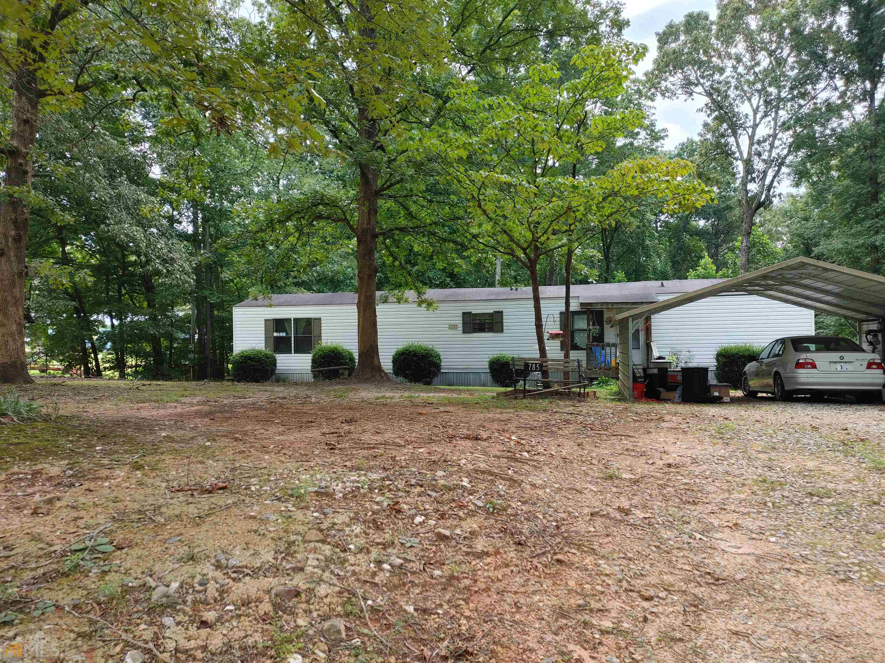 Nice single wide 2 bedroom/2 bath home with 1.2 acres. No HOA, Tenant in place on month to month lease, out by end of September. Title has been retired. Detached carport, front porch and back deck. Level lot perfect for building with nice hardwoods. No FHA, VA or USDA. Selling "As Is".