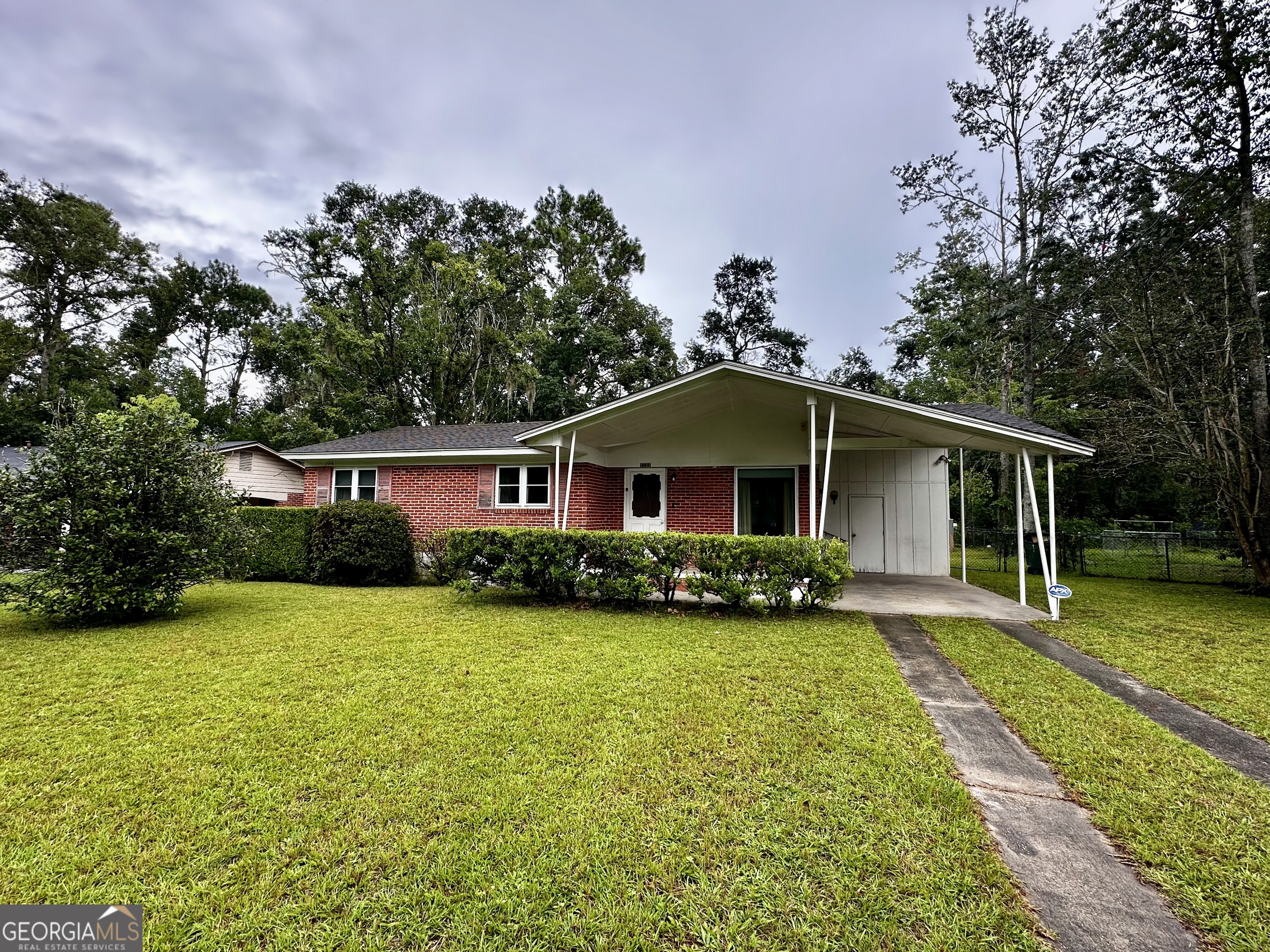 Step back in time with this charming brick home! Built in 1963, this cozy 3-bedroom, 1-bathroom brick home offers the charm of the 50s and 60s while showcasing the solid craftmanship of its era. It is complete with a convenient carport and a storage shed for all your tools and storage. This home is well built, full of character, and ready to welcome its next owners. Whether you are looking for your first home, a downsizing option, or simply a cozy place with vintage charm, this property is a true gem. Schedule your showing today!