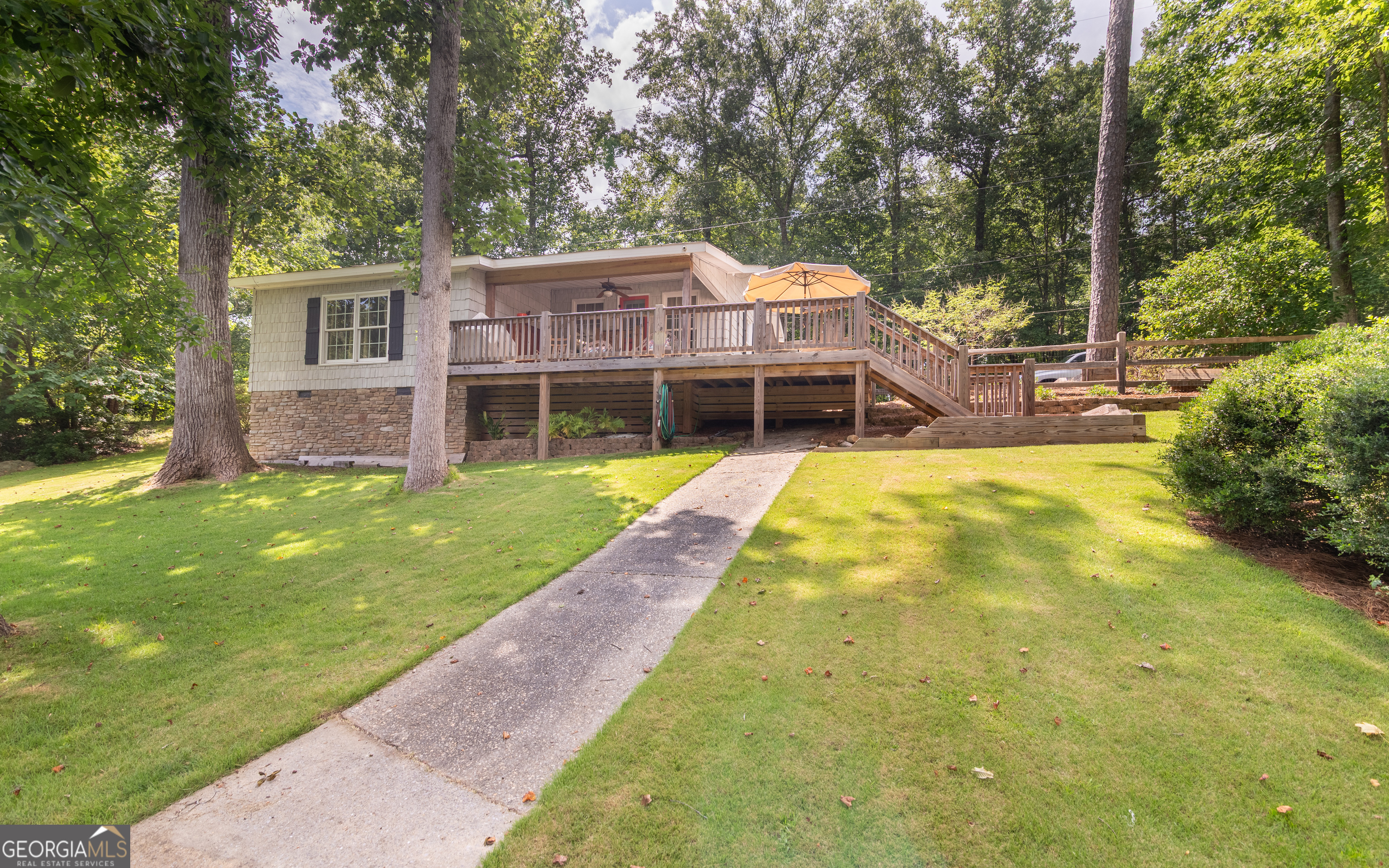 Don't miss out on the opportunity to own this cozy, well-maintained two bedroom, one bath lake house located in a quiet, no-wake cove on beautiful Lake Harding. Enjoy easy acccess to big water and seasonal long range views from all rooms. The property features a spacious deck ideal for relaxing or entertaining as well as a double boathouse with lifts to protect your watercraft, The dock provides an opportunity to fish, swim or just chill out by the water's edge and enjoy the sunset. The HVAC is approximate 3 years old and a new metal roof has been ordered.; the water heater is tankless thereby providing hot water on demand. A large parking pad with a utility shed also serves as an area to enlarge the home (Drawings available). The property is move-in ready. Come enjoy classic lake life in a peaceful setting !!