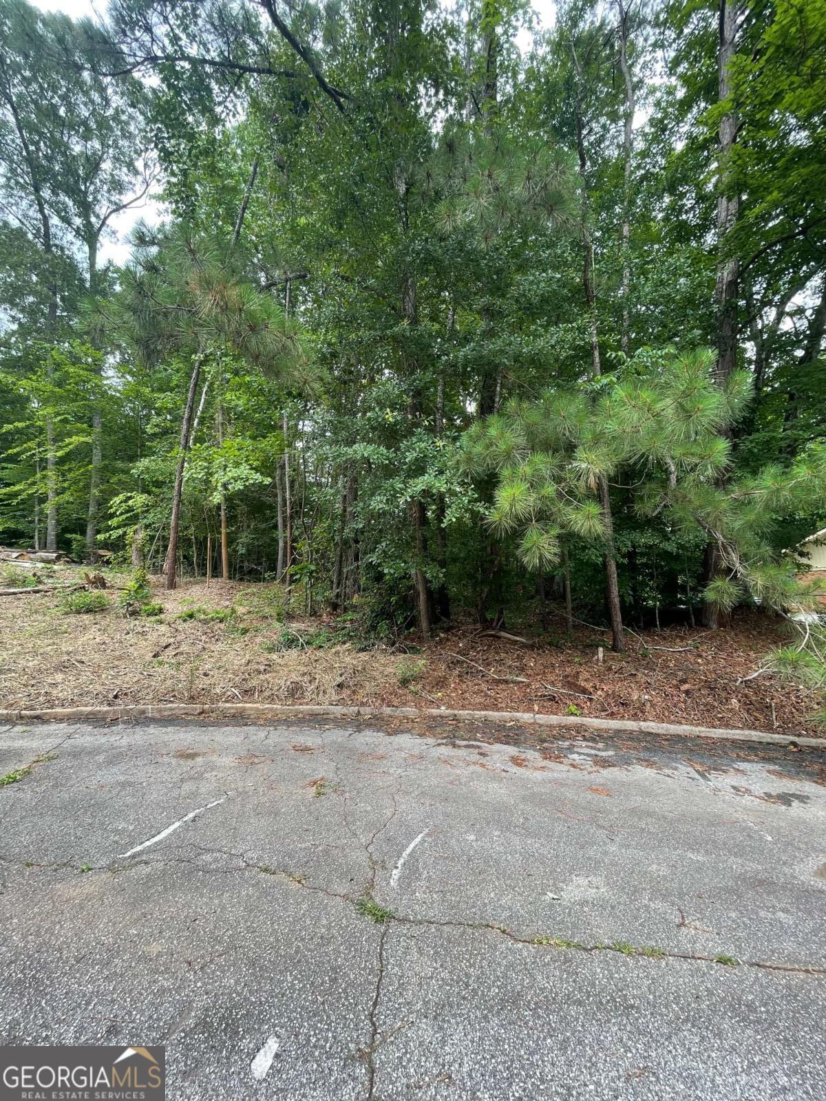**Build Your Dream Home in Peaceful Perfection** Tucked away at the end of a quiet cul-de-sac in a well-established, serene neighborhood, this rare vacant lot offers the perfect canvas for your custom dream home. Surrounded by mature trees and lovingly maintained homes, the setting blends privacy with a sense of community. Whether you're envisioning a cozy retreat or a family estate, this lot gives you the freedom to design a home that fits your vision.