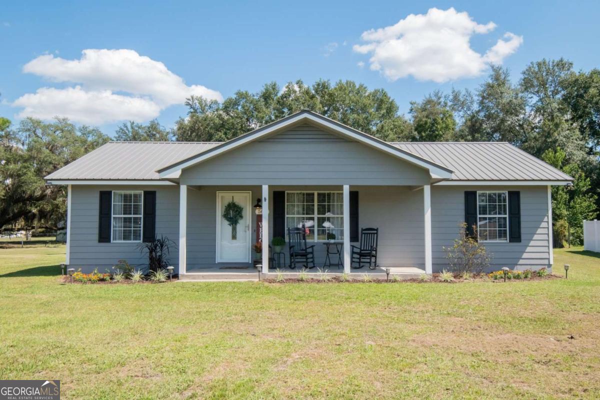 Welcome to 564 Dallas Circle in Folkston! This sweet home has been freshly renovated and is ready for its next chapter. Sitting on a large lot, it offers plenty of room to stretch out and enjoy life outdoors, whether that's sipping coffee on the front porch or relaxing on the back patio. Inside, you'll find a split floor plan with great natural light, new paint, updated light fixtures, and easy-care LVP flooring throughout. The kitchen shines with stainless steel appliances, lots of cabinet space, and a layout that makes cooking and gathering a breeze. A newer tin roof gives you peace of mind for years to come. If you're looking for a move-in ready home with charm, space, and modern updates, this one is waiting for you.