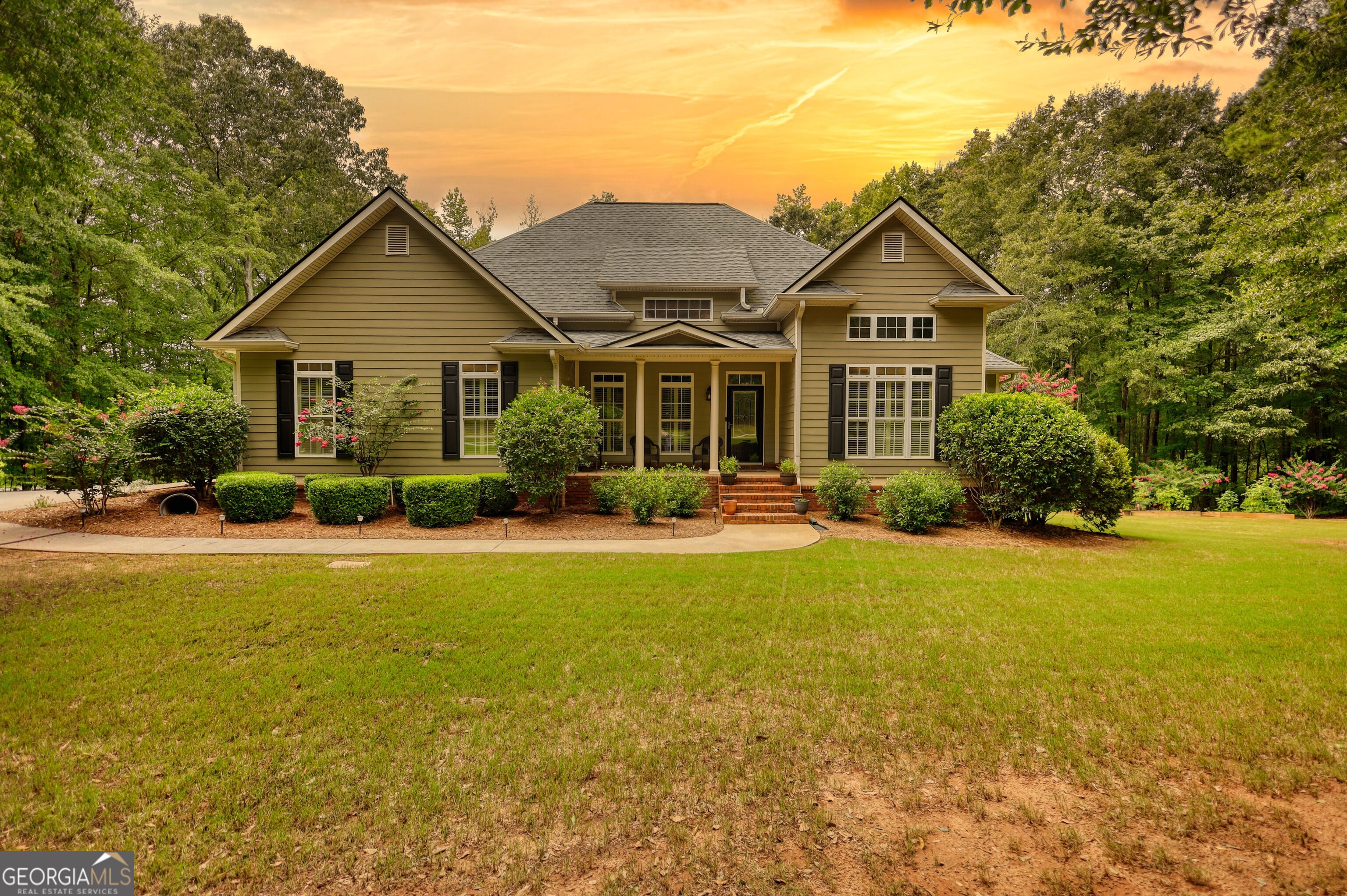 This stunning 5-bedroom, 4-bath home offers the perfect blend of comfort, style, and functionality - all on a beautifully landscaped 2-acre lot. Inside, the main floor features a spacious layout with solid surface countertops, an inviting kitchen, and a seamless flow for entertaining. The attached garage includes a 220 amp receptacle, ideal for charging your electric vehicle. Enjoy peace of mind with a newer roof and a newer main floor AC unit, keeping the home energy-efficient and comfortable. The mostly finished basement is a standout, complete with a full kitchen, its own laundry area, and plenty of space for guests, in-laws, or entertaining all while allowing you some unfinished space ideal for storage and lawn equipment. Step outside to discover a private oasis with an underground irrigation system, low-voltage wired landscape lighting, and a fenced area perfect for pets. The manicured grounds offer room to roam and relax, combining the serenity of country living with modern conveniences. This move-in-ready home truly has it all - come see why it's the perfect place to call home!