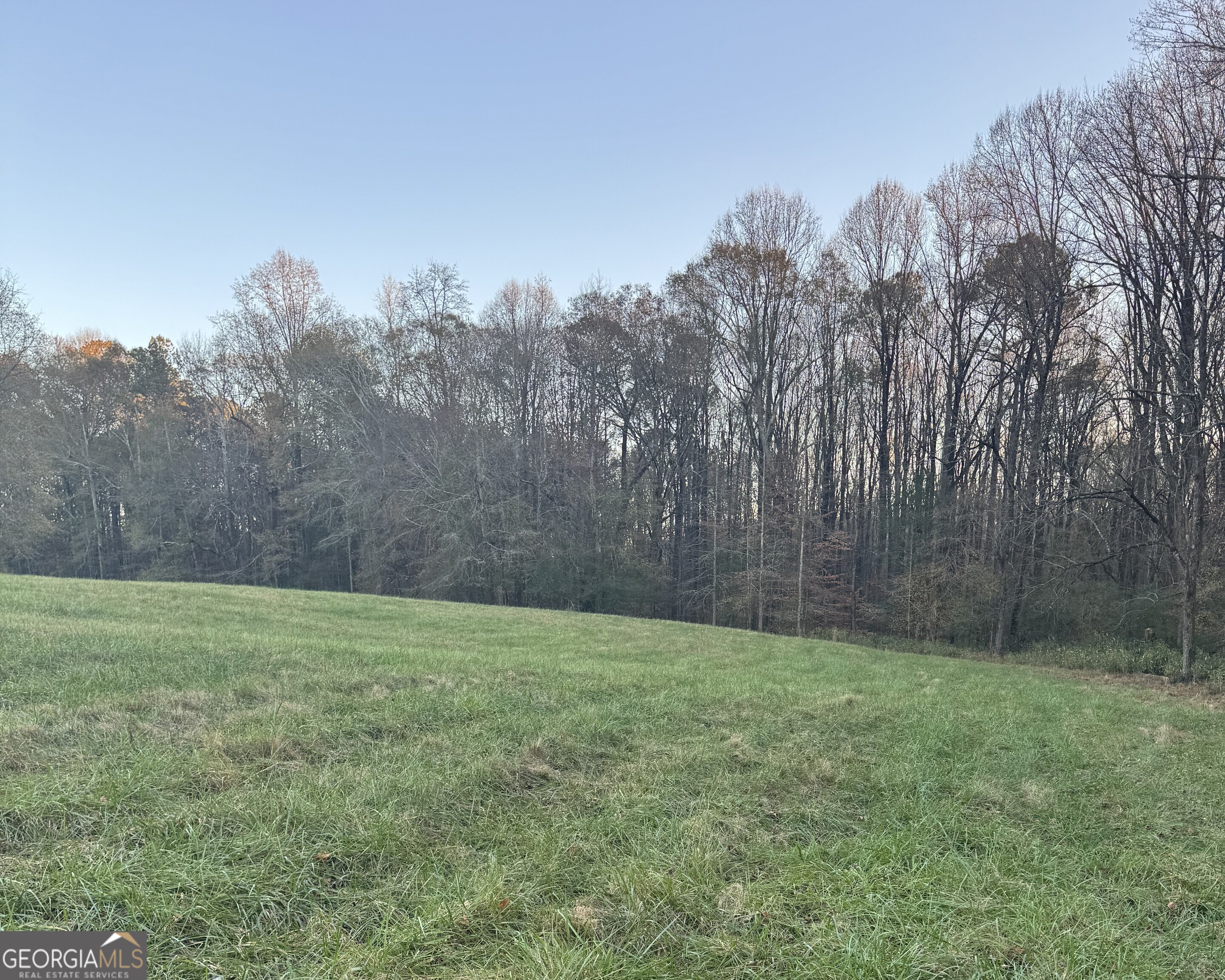 Looking for 5 beautiful acres of land with privacy in North Oconee County? Look no further, as Quiet Oaks Subdivision offers a new residential community of 14, five-acre estate lots where you can build your dream home and enjoy gorgeous sunrises and sunsets. Most lots have towering white oaks and perennial flowing creeks, while several lots also have open fescue fields for your horse and two lots share a fishpond. Quiet Oaks is conveniently located about 2 miles from the intersection of Highway 53 and US 78, where Stripling's General Store is located. Oakley Trail has streetlights, underground power to each of the lots and the paved road is maintained by the county. Your investment will be protected with covenants that, in part, require 1 story homes to have 2,500 sq. ft. and 2 story homes to have 3,000 sq. ft. This property has easy access to Highway 316 which is about 5 miles away and it is less than 5 minutes to the new Dove Creek Elementary and Middle School. Contact Thomas Verner at 706-540-4912 for more information