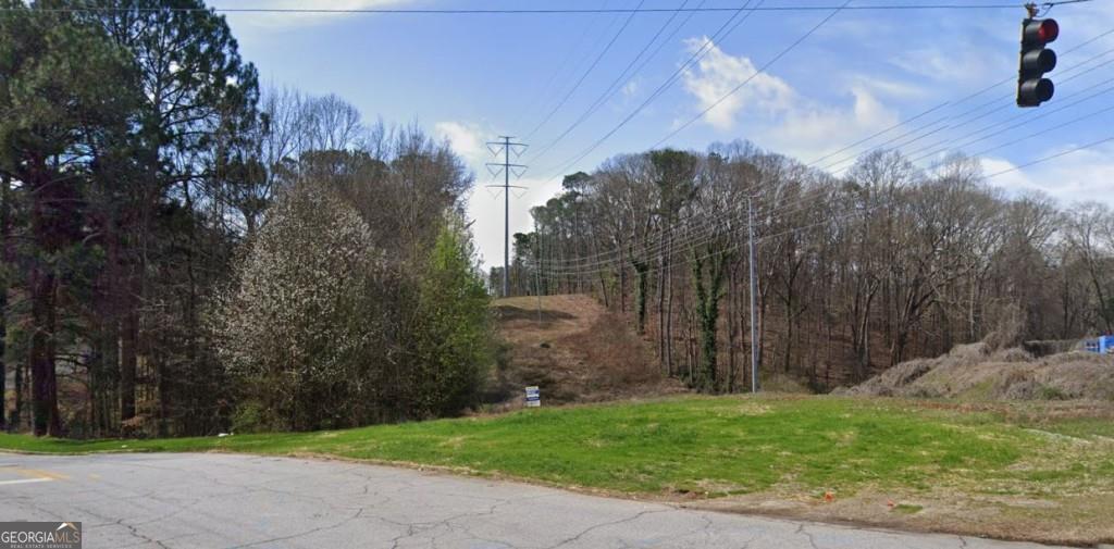 This prime residential lot in East Point, GA, is ideally situated just minutes from Tyler Perry Studios and Greenbriar Mall, offering unparalleled convenience for both work and leisure. The property is also in close proximity to Downtown East Point, Hartsfield-Jackson Atlanta International Airport, and major highways, ensuring easy access to a variety of amenities and destinations. The lot is zoned for residential use, providing an excellent opportunity to build your dream home in a vibrant and growing community. Its strategic location near key attractions and transportation hubs enhances its appeal for potential homeowners. This property presents a unique opportunity to create a custom residence in a sought-after area.
