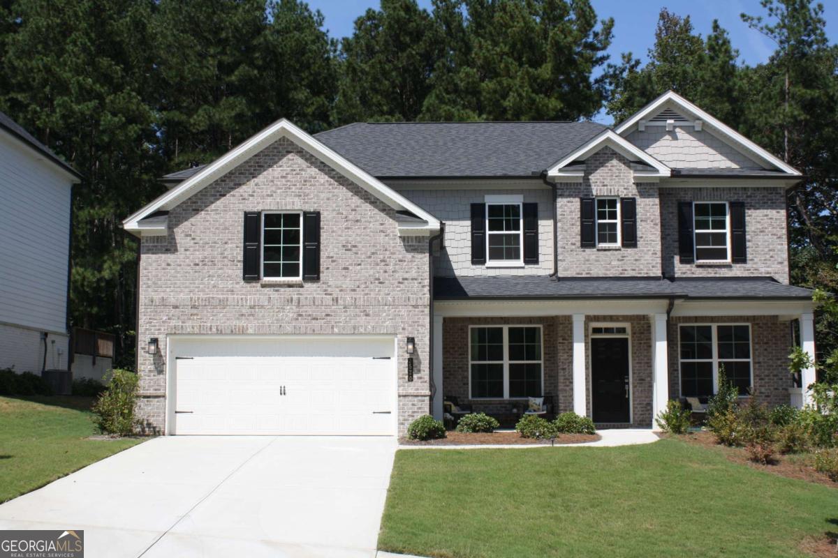 This beautiful almost new home has a fantastic floorplan. You enter the home into a 2 story foyer with a living room/office with French doors on the left and a formal dining room on the right. The formal dining room has an attached Butler Pantry and walks through to the amazing kitchen. The kitchen has a huge island,abundant cabinets,walk in pantry, double ovens,gas cooktop,external exhaust,large breakfast/dining area and is open to the attached great room.The great room has an electric ignition gas log fireplace and walks out to a covered patio.A fantastic and unique feature for this home is the extra room beyond the great room. This is a small room that could be an office,play room, etc. There is a first floor bedroom with a walk in closet which attach's to a full bathroom. Directly inside the home from the garage is a mud area to change shoes etc. The two car attached garage is level with the first floor. The second level has a large loft that provides a a perfect gathering area. The master is on this level with it's oversized closet, his/hers sinks,glass enclosed shower,soaking tub,private water closet,and generous sized bedroom.There are Jack and Jill bedrooms with their own bath and closets. The fourth upstairs bedroom has it's own private bathroom and walk in closet.The laundry room is on this level. It offers generous space for not only the washer and dryer but for ironing,laundy hampers,etc.The nice level lot,covered patio,2 car attached garage,etc. contribute to a high quality of living. The property is is located in a superb school district and is in close proximity to restaurants,shopping,and major roads including I-85.