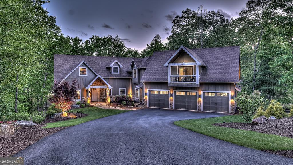 Welcome to 1533 Old Toccoa Loop, a luxurious mountain retreat nestled within the prestigious Old Toccoa Farm, award-nominated 18-hour golf course and fly fishing community. This exceptional 4-bedroom, 4.5-bathroom home offers unparalleled craftsmanship and resort-style living and is designed for both relaxation and entertainment, this residence seamlessly blends rustic elegance with modern amenities. The spacious primary suite located on the main level features a cozy fireplace and direct access to the screened-in porch, creating a serene sanctuary. A chef's dream, the kitchen boasts a large island, walk-in pantry, and top-of-the-line appliances, perfect for culinary enthusiasts. The expansive great room showcases a stunning stacked stone fireplace and vaulted ceilings, providing a grand space for gatherings. Enjoy year-round outdoor living with a screened-in porch featuring a fireplace and hot tub deck, ideal for relaxing or entertaining. A dedicated office space on the main level offers a quiet area for work or study. Stay active with a fully equipped private gym, ensuring convenience and privacy. Ample storage and parking are provided with a spacious three-car garage. Situated on the award-winning Old Toccoa Farm golf course, residents enjoy breathtaking views and easy access to the Toccoa River with over 4,000 feet of the Toccoa River for fishing and recreation. Other amenities include The Tavern, a gathering place for residents and members to enjoy award winning culinary, golf pro-shop and walking trails throughout the development. Upcoming amenities include pickleball, tennis, and a riverfront pavilion, all slated to commence this year!