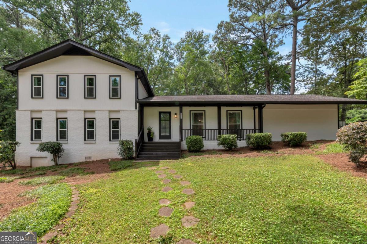 Beautifully renovated (2022) 5-bedroom, 3.5-bath home nestled on a nearly half-acre, corner lot in sought-after Hampton Hall. The main level offers an open-concept design with new hardwood floors and a chef-inspired kitchen. Enjoy quartz countertops, a large island with a wine cooler, and seamless flow to the dining area and a new deck. A practical mudroom and two-car garage add convenience. Upstairs features the lovely primary suite with a fully renovated bath, plus two additional bedrooms and an updated hall bath. The flexible lower level offers two more bedrooms, a full bath, a family room with a fireplace, and a walkout patio-ideal for guests or multi-generational living. Enjoy hard-surface floors throughout and a low-maintenance backyard. Optional Hampton Hall Swim/Tennis and nearby parks are minutes away. Prime location near top schools, Brookhaven Village, and access to I-85/285/400 and MARTA. A private, modern retreat in the heart of Brookhaven.