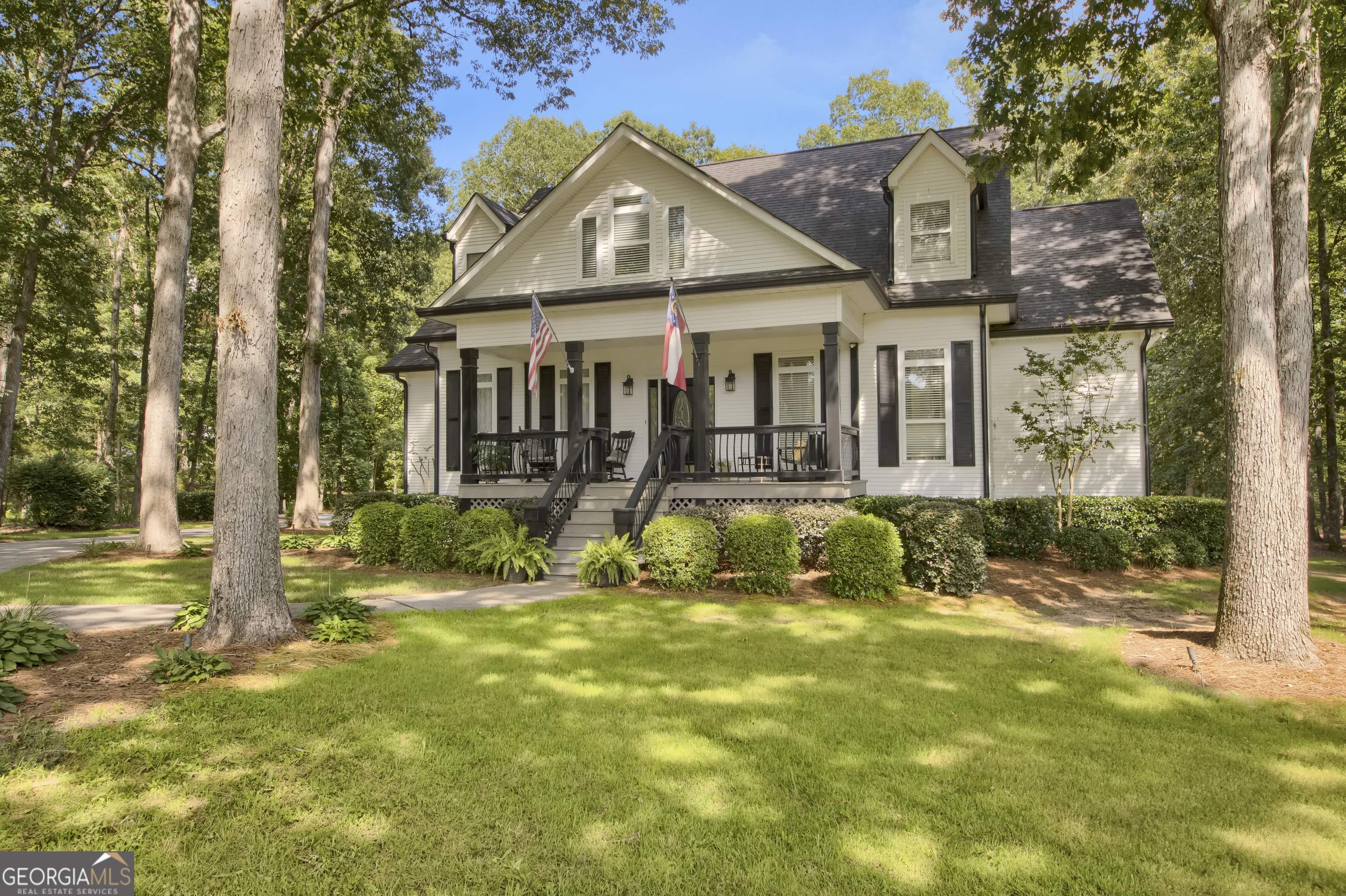 Serene 17-Acre Estate in the Desirable Ola School District - Private Pond & Workshop! Welcome to 595 S. Antioch Road, a breathtaking setting in McDonough, offering a perfect blend of privacy, natural beauty, and spacious living. This stunning property features manicured pastures, wooded areas, and a nearly 3-acre spring-fed private pond-a true countryside retreat. The nearly 4,000 sq. ft. main home, lovingly built and well-maintained by its original owners, features a charming front porch, expansive back deck, and screened back porch-ideal for enjoying the serene landscape. Inside, you'll find a spacious living room with soaring ceilings and a striking fireplace. The kitchen is open with wood cabinetry, granite countertops, and all appliances included. The Formal dining room conveniently located off the foyer and kitchen. The primary bedroom features a tile shower, soaking tub, and oversized walk-in closet. Also located on the main floor, you'll find two additional bedrooms with a shared full bathroom. The upstairs level features a loft area with built-in shelving as well as a 4th bedroom/Office and a large full bathroom. There is also a large bonus room/Den currently being used as a game room complete with pool table and foosball table that are included with the sale! Additional storage space or an easily convertible 5th bedroom make the expandable attic space another great feature. The unfinished basement offers 2,200+ sq. ft., a boat door, and endless possibilities-convert it into additional living space or keep it for extra storage. As an added bonus, this property includes a 1,650 sq. ft. workshop with five roll-up doors and a lean-to, perfect for hobbyists, mechanics, or farmers. With detailed interior trim, an irrigation system, and countless extras, this unique property is truly one-of-a-kind. Schedule your private tour today and experience the charm and tranquility of this McDonough gem!
