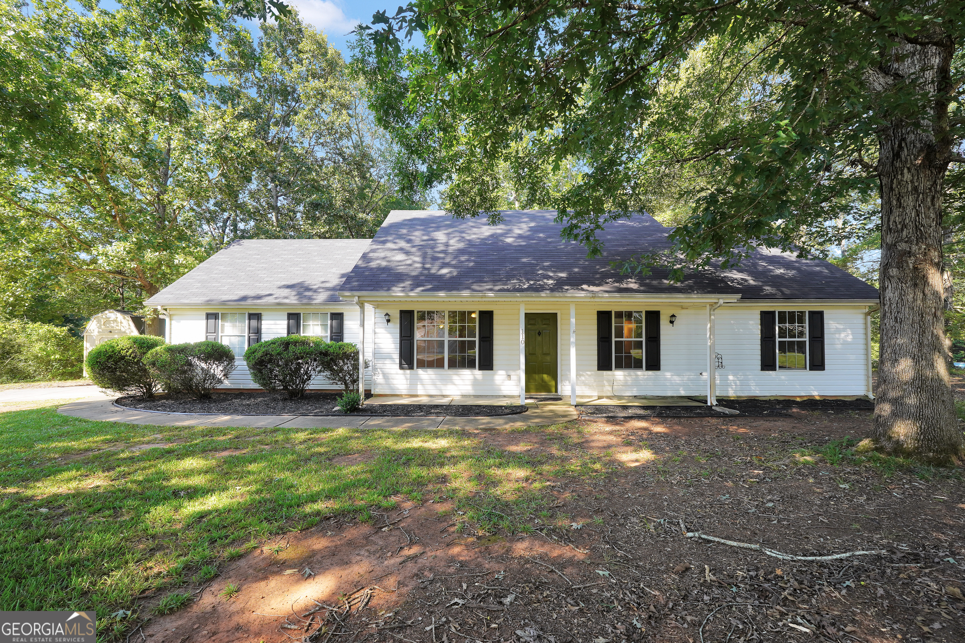 Welcome to 110 Pebble Creek Dr! Discover this inviting 3-bedroom, 2-bathroom home perfectly situated on a picturesque 0.5-acre corner lot in a conveniently located and established neighborhood. Step inside to find fresh paint and brand-new carpet, creating a bright and welcoming atmosphere. The well-appointed kitchen, complete with stainless steel appliances, overlooks the backyard, making it easy to enjoy the beautiful views while cooking or entertaining. Recent updates provide peace of mind, including a roof that's just 2 years old and an AC unit only 3 years old. Outside, enjoy a private, fenced backyard with a playset, perfect for family fun and entertaining. Mature shade trees surround the property, offering a serene setting and enhancing the home's warm and inviting curb appeal. This move-in ready property blends comfort, charm, and convenience-an ideal place to call home!