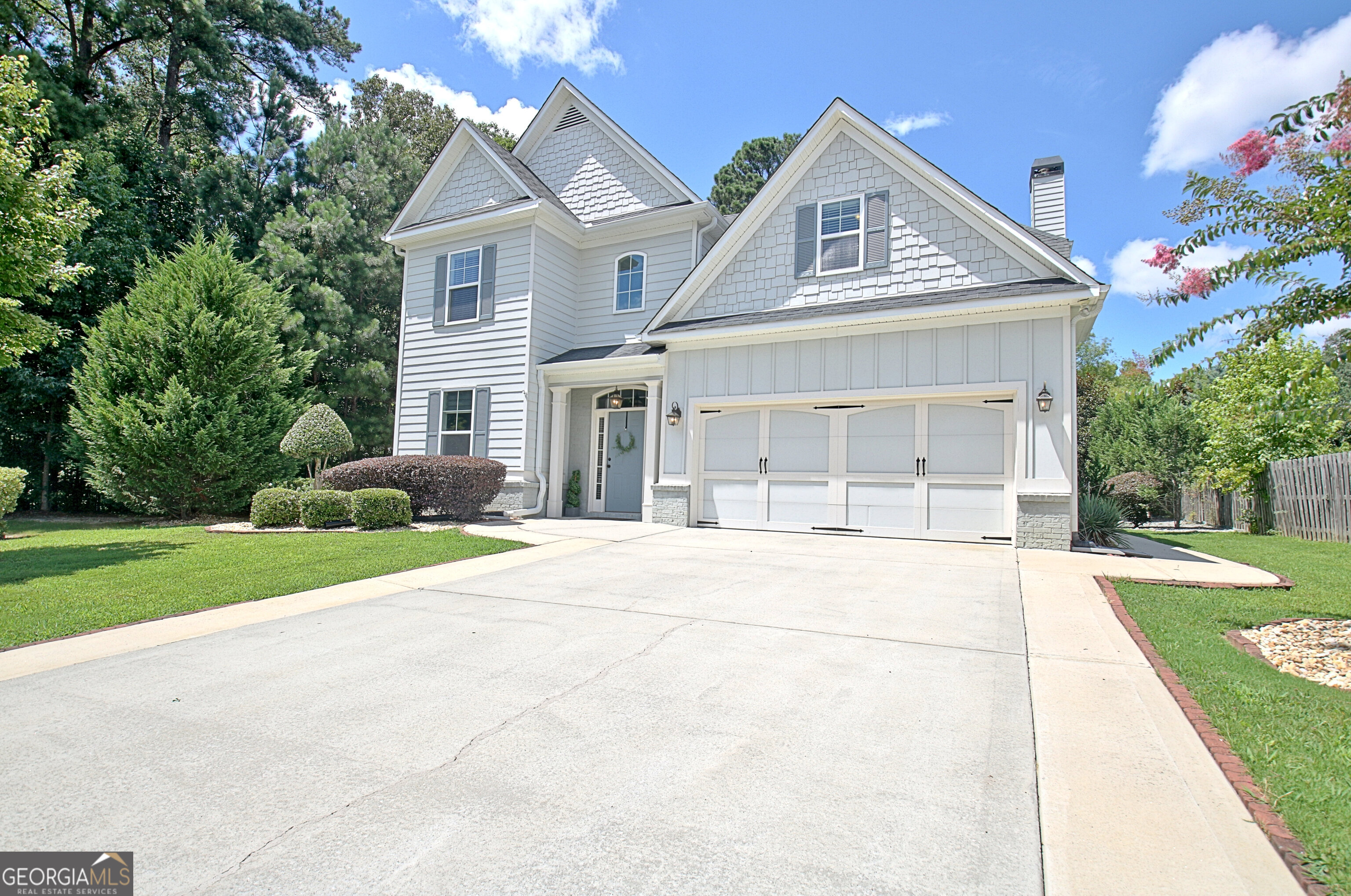 Gorgeous Former Model Home Built in 2011, Highly Upgraded and just shy of 3,000 sq ft, Spacious 4 Bedroom Plus 3 Full Bath with Loft and Bonus Area with McIntosh HS and one of Peachtree City's most popular neighborhoods--Easy Golf cart Ride to Shopping and Restaurants with no HOA fees. Inside, you'll find custom features throughout: Gourmet kitchen with custom cabinetry, exotic granite on designer island, custom back-splash with under-cabinet lighting and a large walk-in pantry. All opening up to the Great room featuring coffered ceilings with real wood-burning fireplace. Separate Formal Dining Room Plus Full Bedroom and Bath on main level with pocket door for extra privacy--perfect for In-laws and guests. Two-Story Foyer and Beautiful Wood floors Throughout Main Level. But Wait, it gets even better Upstairs with loft area plus a separate office or kid hang-out area. Luxurious primary suite featuring spa bath with vaulted ceilings, soaking tub, tiled shower, custom-built-ins and a massive walk-in closet. Secondary Bedrooms with Walk-in Closets. Thoughtfully designed for both comfort and style with wood tread stairs, French doors leading to an extended covered patio overlooking a lush and completely private backyard. Concrete walkways, extended driveway, sprinkler system and upgraded insulation plus an oversized garage to add to the upgrade list. Private end lot sitting next to green space makes this a peaceful, natural setting. Offering an amazing floor plan, efficiency and quality with details that make this one-of-a kind home! All Freshly Painted, 3-Year Old A/C & Move in Ready! Come fall in love with your forever home in Peachtree City! Excellent Schools Zoned for PTC Elementary, JC Booth and McIntosh HS.