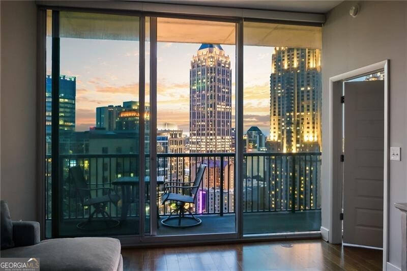 Gorgeous 23rd-floor residence in the highly sought-after 1010 Midtown! This impeccably maintained unit features soaring 10-foot ceilings, upgraded hardwood floors throughout, and a private balcony offering sweeping skyline views. The spacious primary suite includes a double vanity, separate tub and shower, and a custom walk-in closet system. The secondary bedroom boasts newly added built-ins, providing stylish and functional storage. Enjoy resort-style living with top-tier amenities including a pool, state-of-the-art fitness center, and on-site restaurants-all in one of Midtown's most desirable communities.