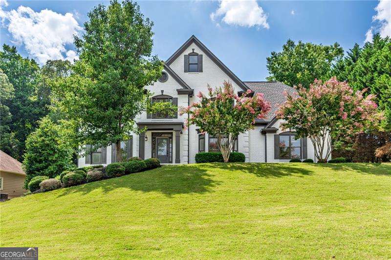 Bradshaw Farms, a sought after swim/tennis/golf community has a beautiful new listing with upgrades galore. Walking in to your two-story grand foyer, you will immediately notice the decorative trim that really transforms this room. No lack of space as there's an office to your left and formal dining room to your right. Kitchen has been completely renovated with new floor to ceiling cabinets, new appliances, textured backsplash and stunning quartz countertops with a view to your family room. You also have a bedroom and full bath completed with new tile and a gorgeous vanity on the main level, perfect for your out of town guest. Upstairs you will find an oversized master suite with his and her walk-in closets and a master bath that will take your breath away completed with double vanities, free standing tub, large glass shower and high end tile that mimics wood. Upstairs you will find three additional bedrooms, one perfect for a media room, and two more baths, again with updated tile and vanities. Looking for a place to relax or house your parents? The basement is completed finished with room for a large kitchen, laundry room, living room and office, along with a bedroom and private access to outside. This lot is over half an acre, perfect for a pool, fire pit and anything else your heart desires. The deck off the back has been completely replaced, along with one HVAC unit, brand new flooring and paint. Come check out this beauty!